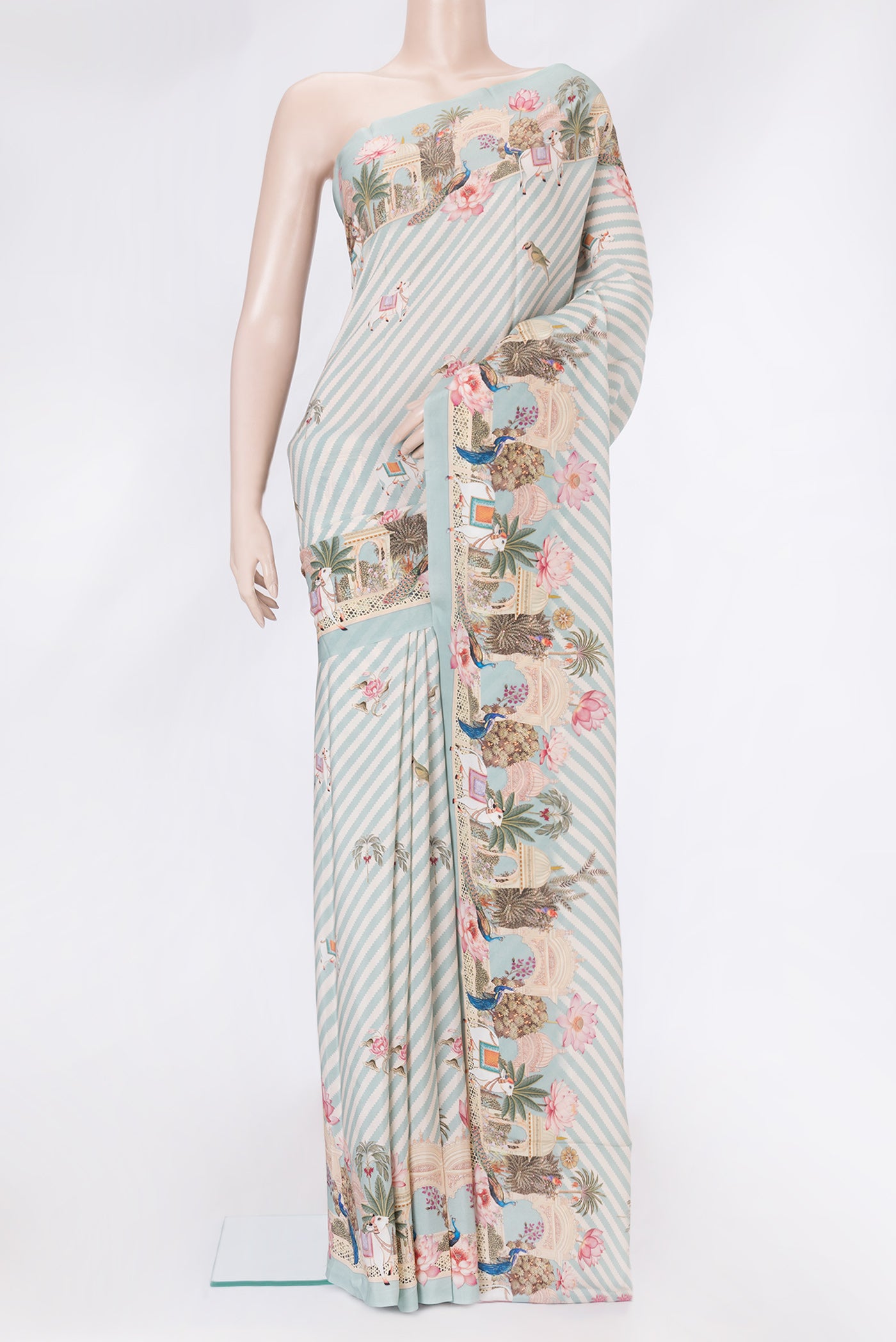 Light Blue Dual Tone Mysore Crepe Saree with Printed design on the body and Plain Border.  displayed on a mannequin