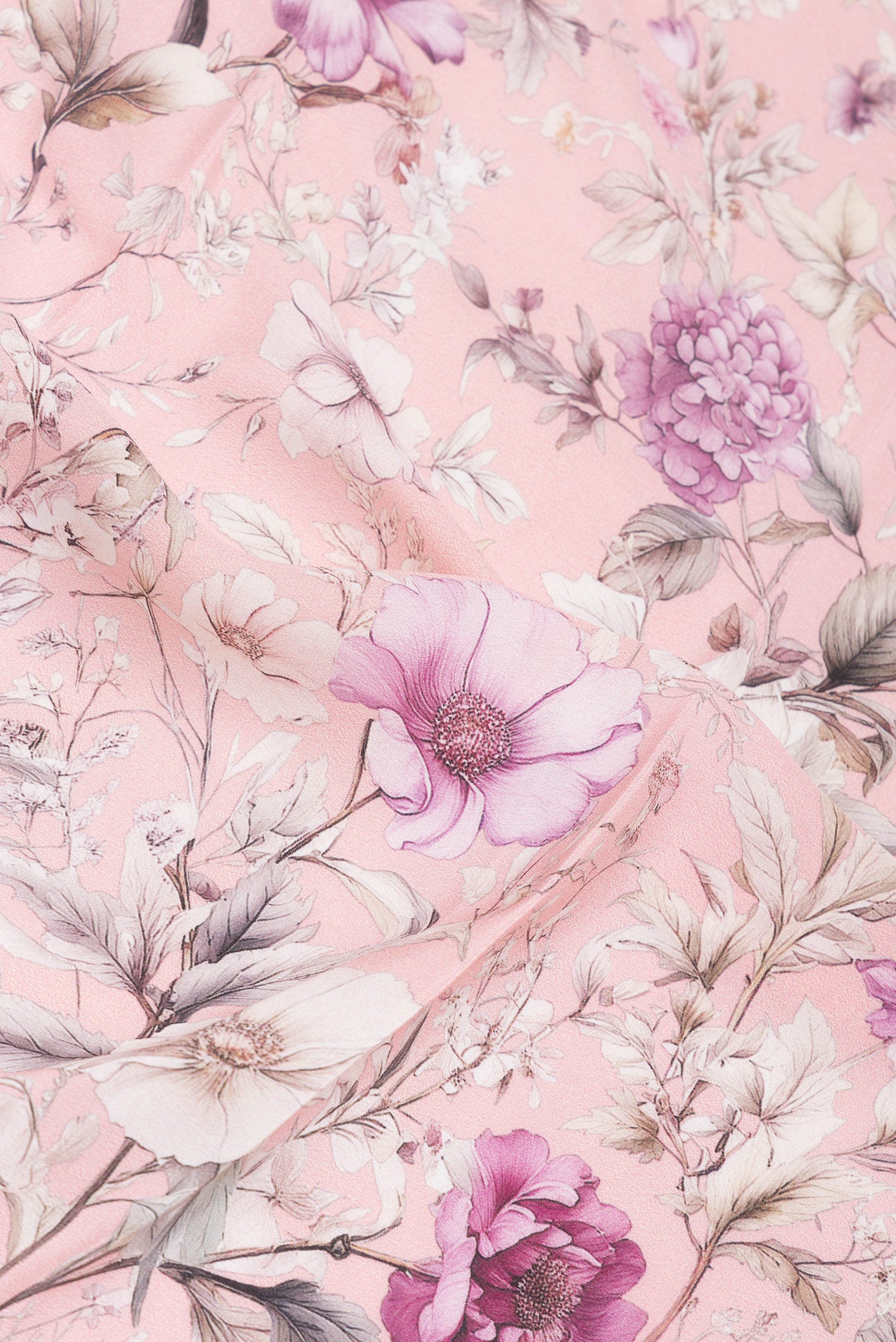Close up of Rose Gold Crepe Saree with Floral Print on the body and Without Border.  displaying folds