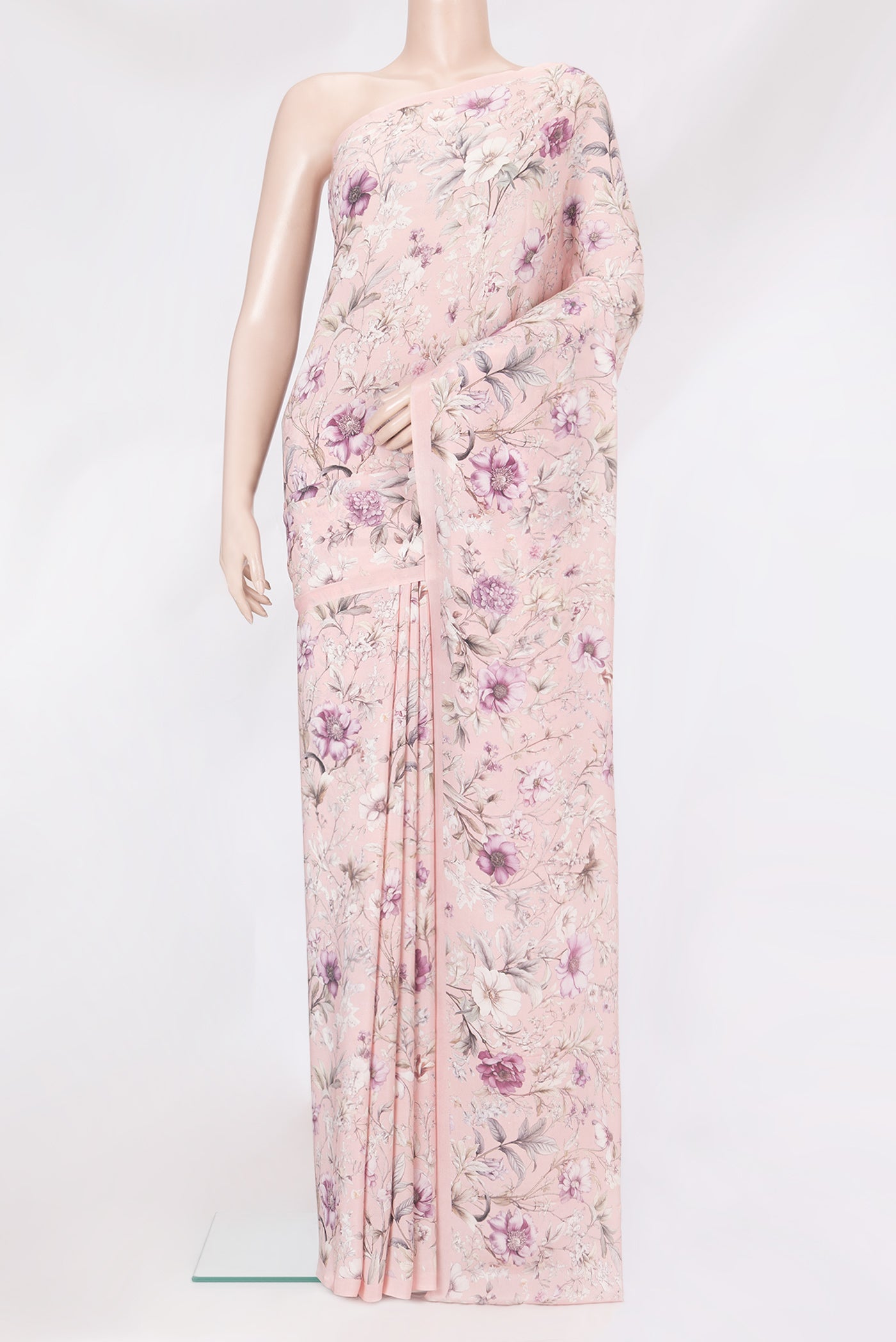 Rose Gold Crepe Saree with Floral Print on the body and Without Border.  displayed on a mannequin