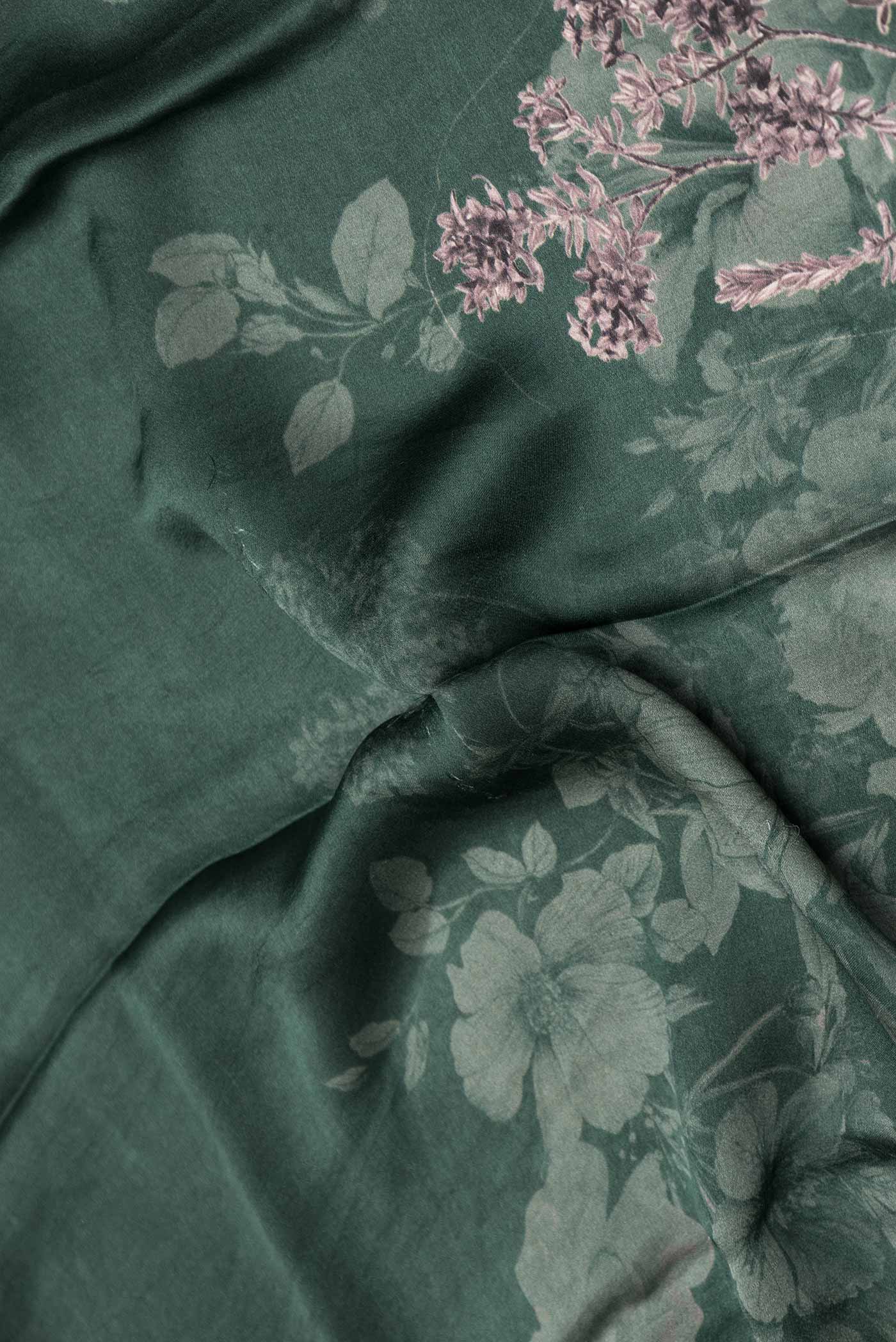 Close up of Green Dual Tone Tussar Silk Saree with Printed design on the body and Zari Border displaying folds