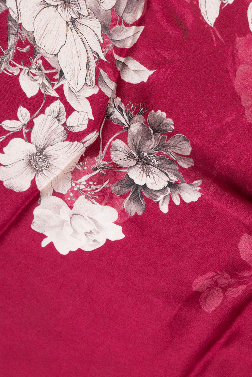Close up of Dark Pink Dual Tone Mysore Crepe Saree with Printed design on the body and Zari Border.  displaying folds