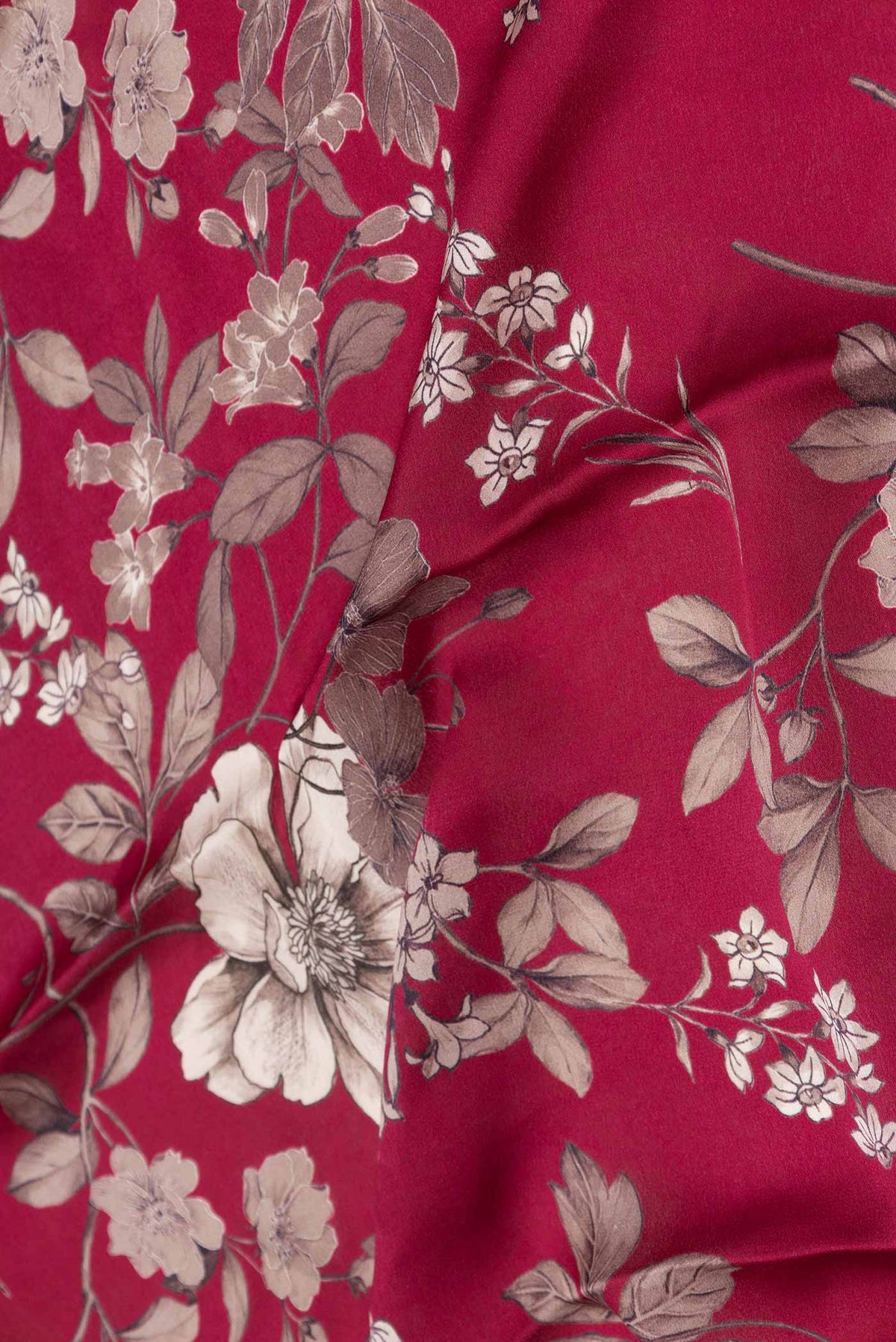 Close up of Dark Pink Dual Tone Tussar Silk Saree with Printed design on the body and Zari Border displaying folds