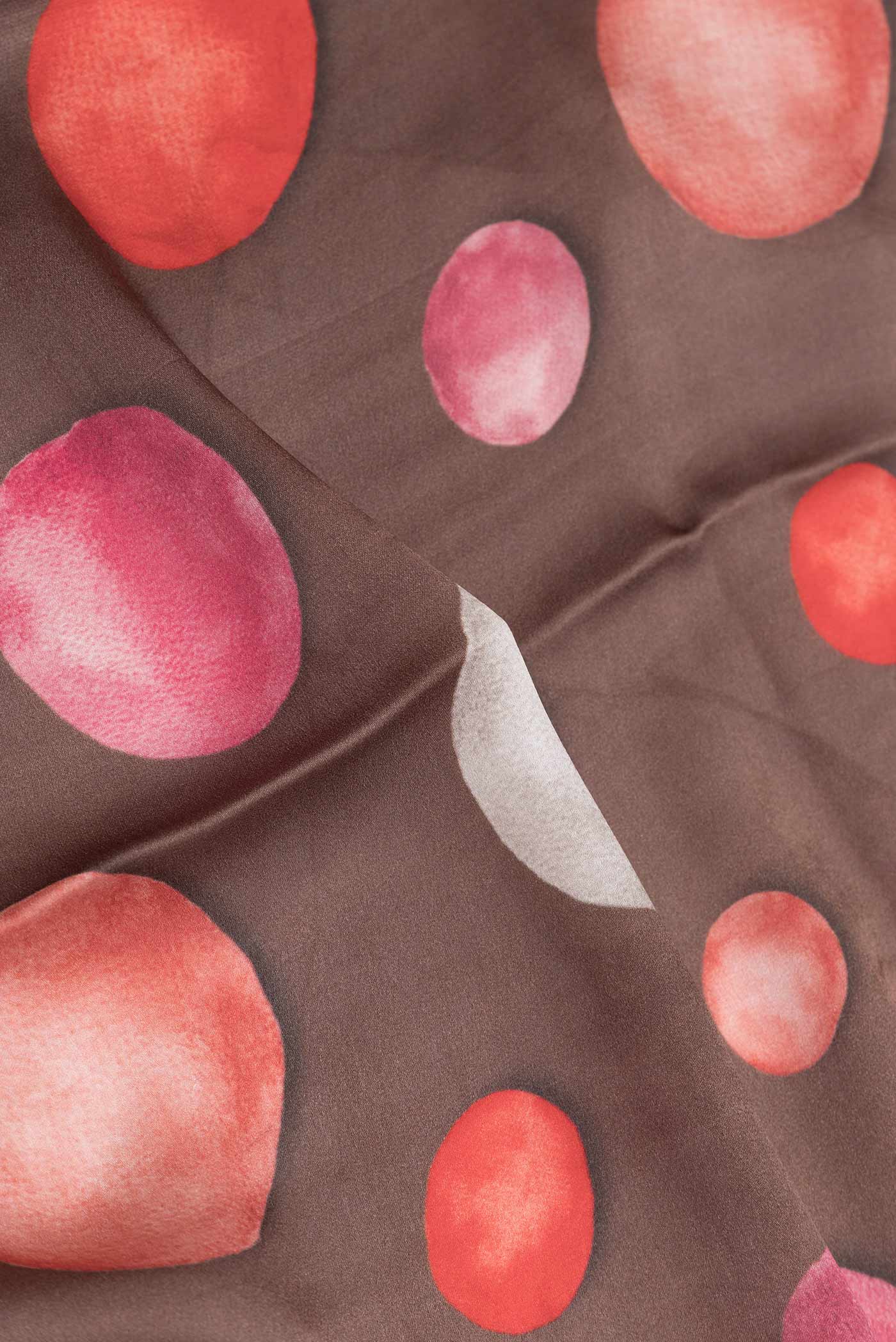 Close up of Brown Dual Tone Mysore Crepe Saree with Printed design on the body and Zari Border displaying folds