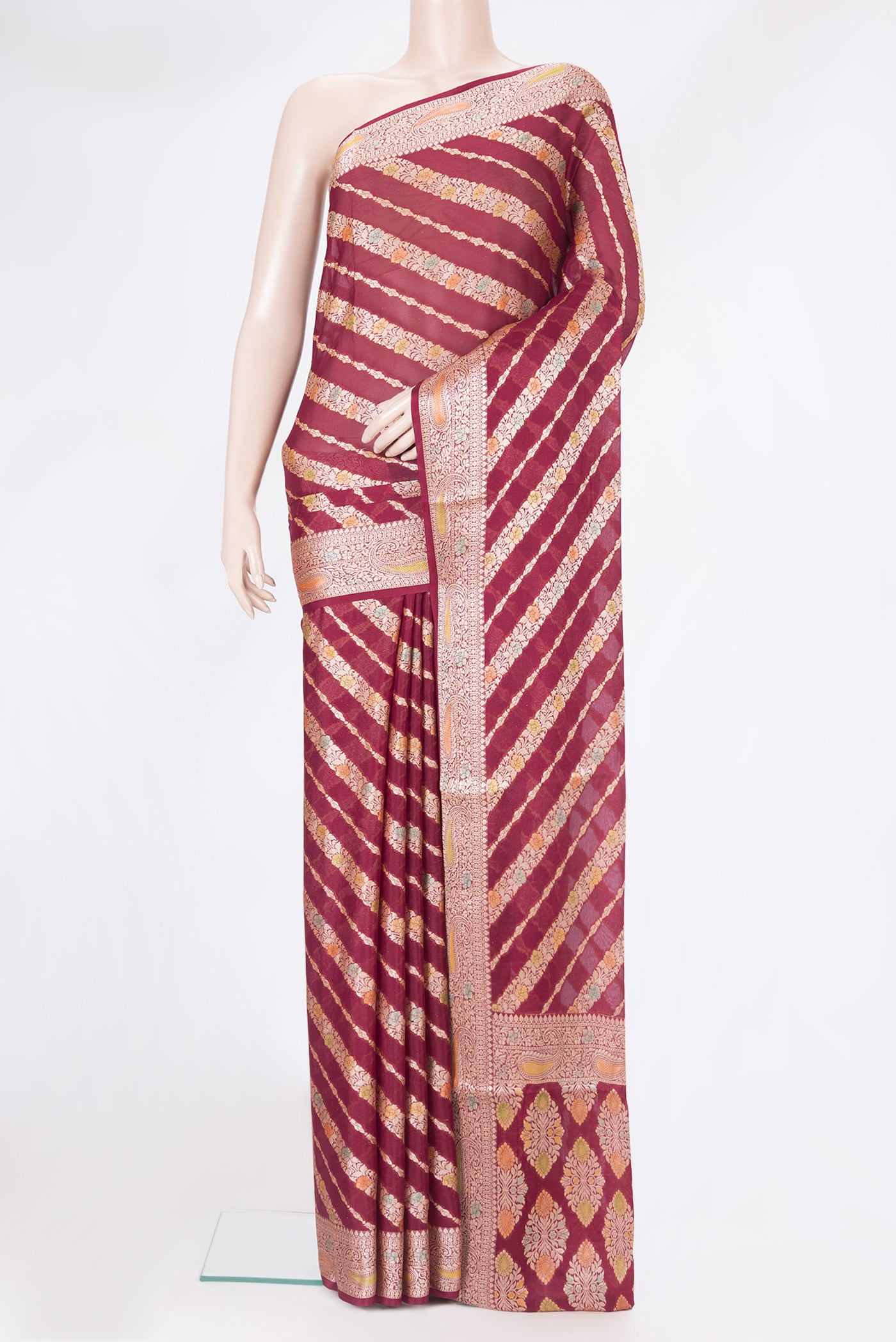 Maroon Banarasi Georgette Saree with Zari Brocade on the body and Zari And Thread Border.  displayed on a mannequin