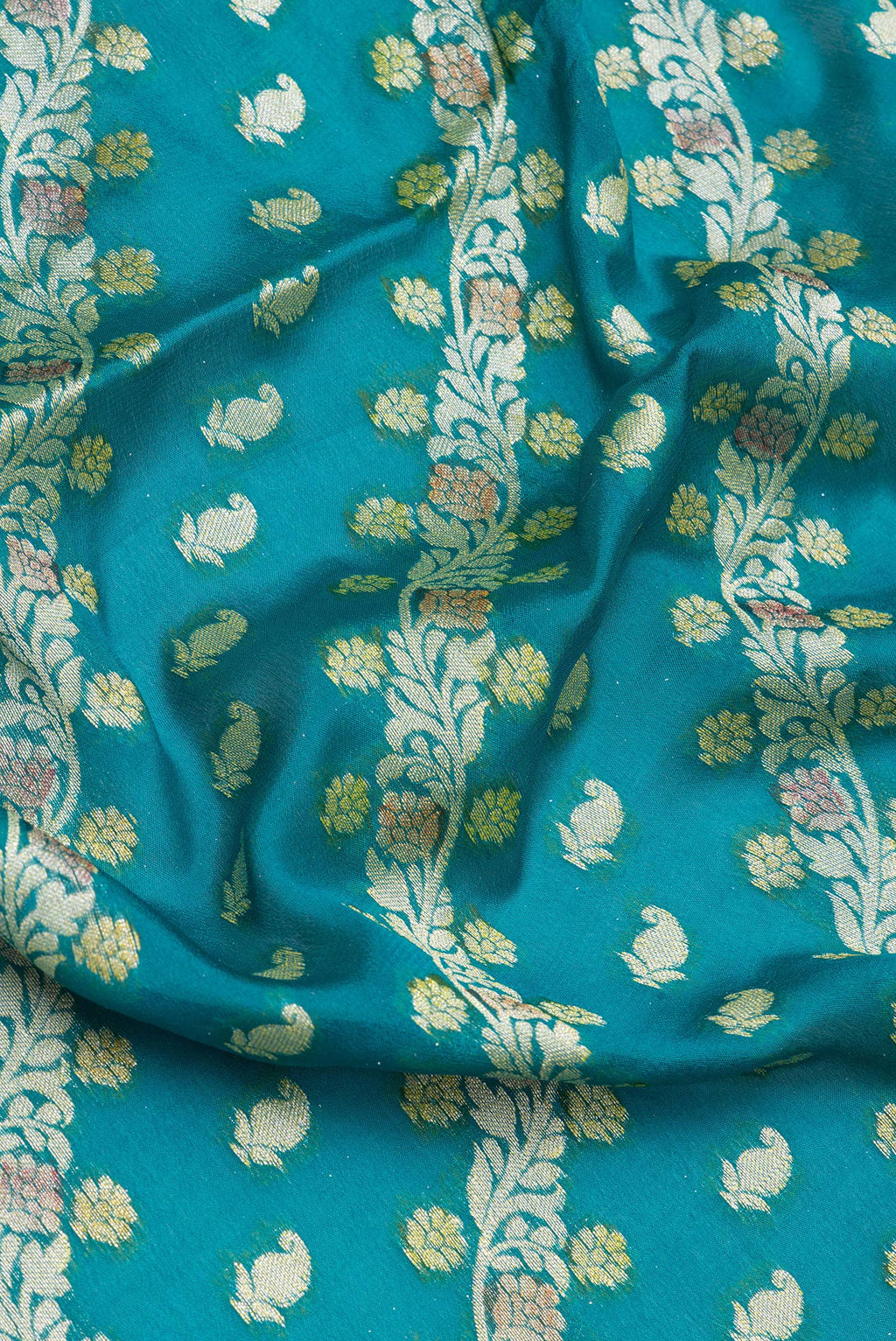 Close up of Peacock Blue Banarasi Georgette Saree with Zari And Thread Butta on the body and Zari And Thread Border.  displaying folds