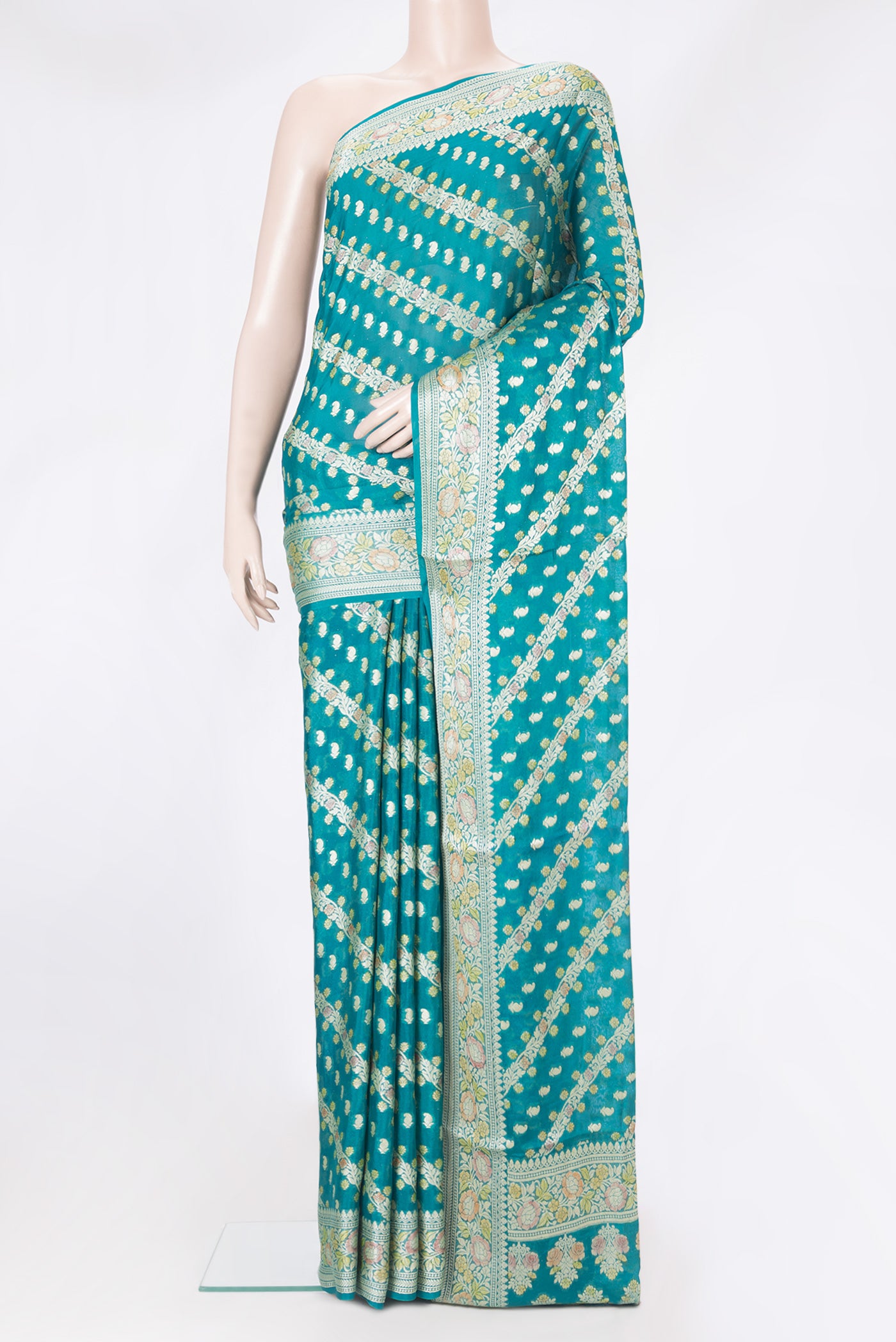 Peacock Blue Banarasi Georgette Saree with Zari And Thread Butta on the body and Zari And Thread Border.  displayed on a mannequin