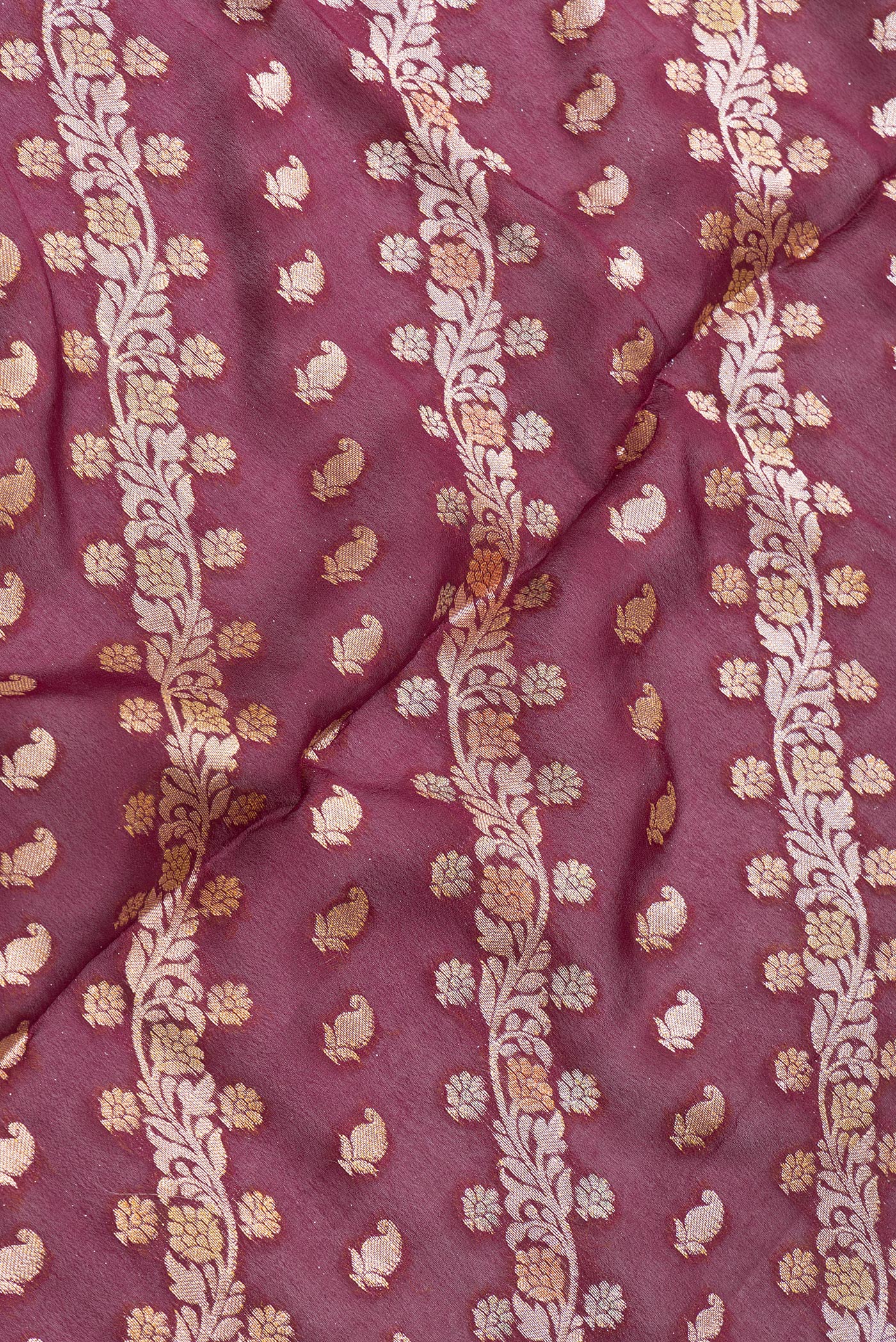 Close up of Maroon Dual Tone Mysore Georgette Saree with Zari Brocade on the body and Thread Border.  displaying folds