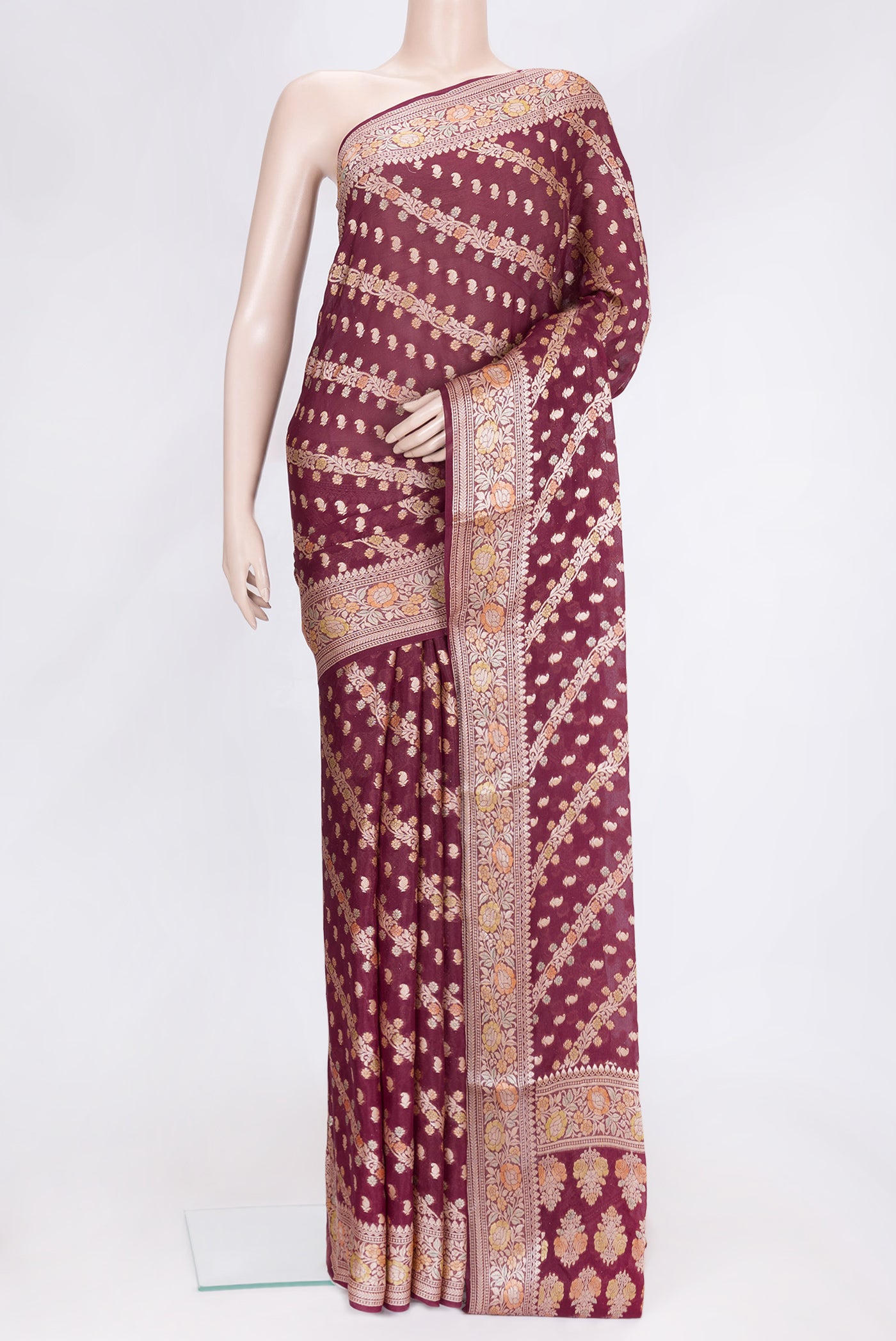 Maroon Dual Tone Mysore Georgette Saree with Zari Brocade on the body and Thread Border.  displayed on a mannequin