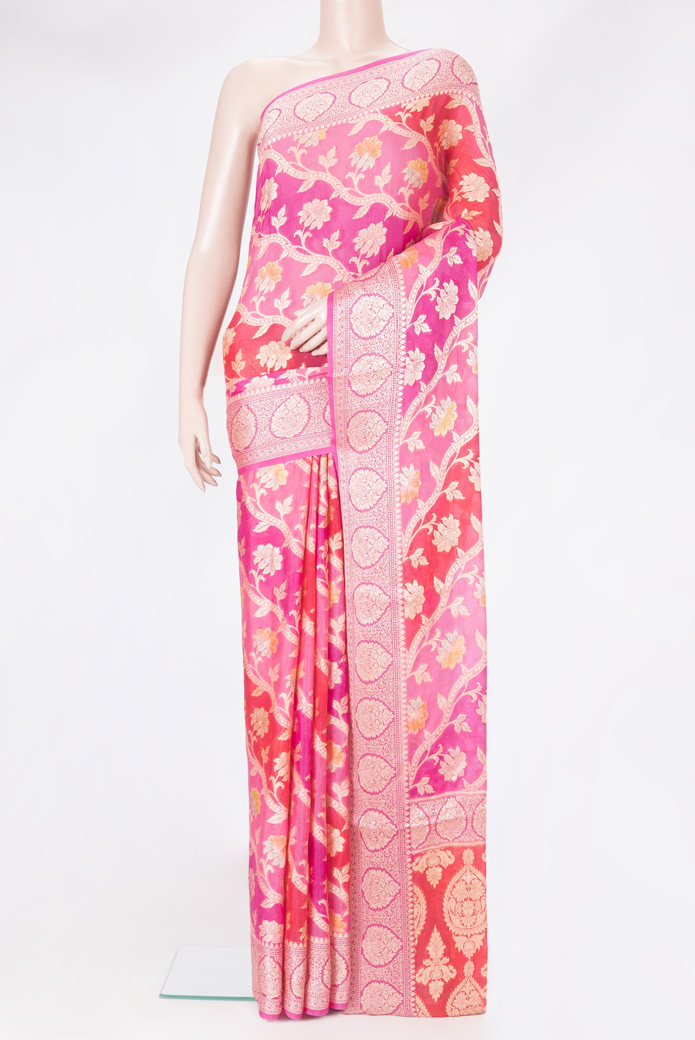Pink Banarasi Georgette Saree with Zari And Thread Butta on the body and Zari Border.  displayed on a mannequin