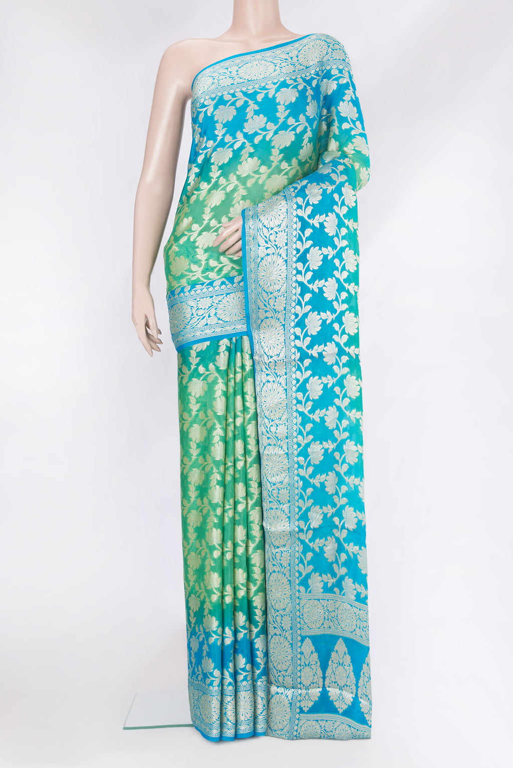 Sea Green Banarasi Georgette Saree with Zari Brocade on the body and Zari Border.  displayed on a mannequin