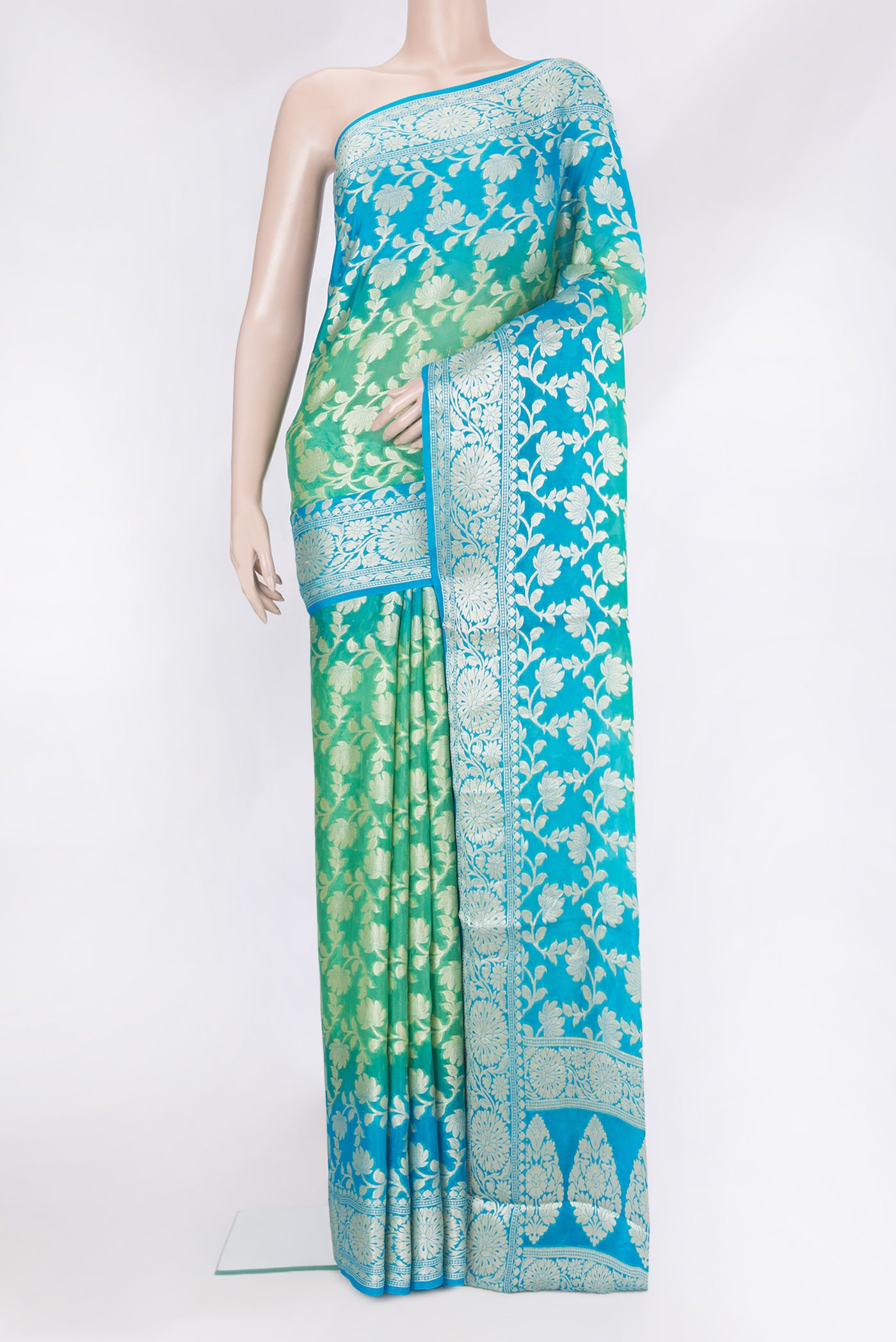Sea Green Banarasi Georgette Saree with Zari Brocade on the body and Zari Border.  displayed on a mannequin