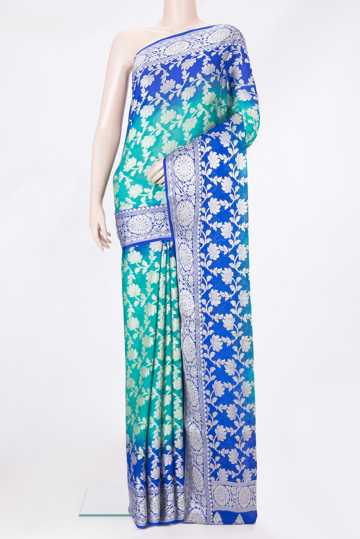 Sea Green Banarasi Georgette Saree with Zari Brocade on the body and Zari Border.  displayed on a mannequin