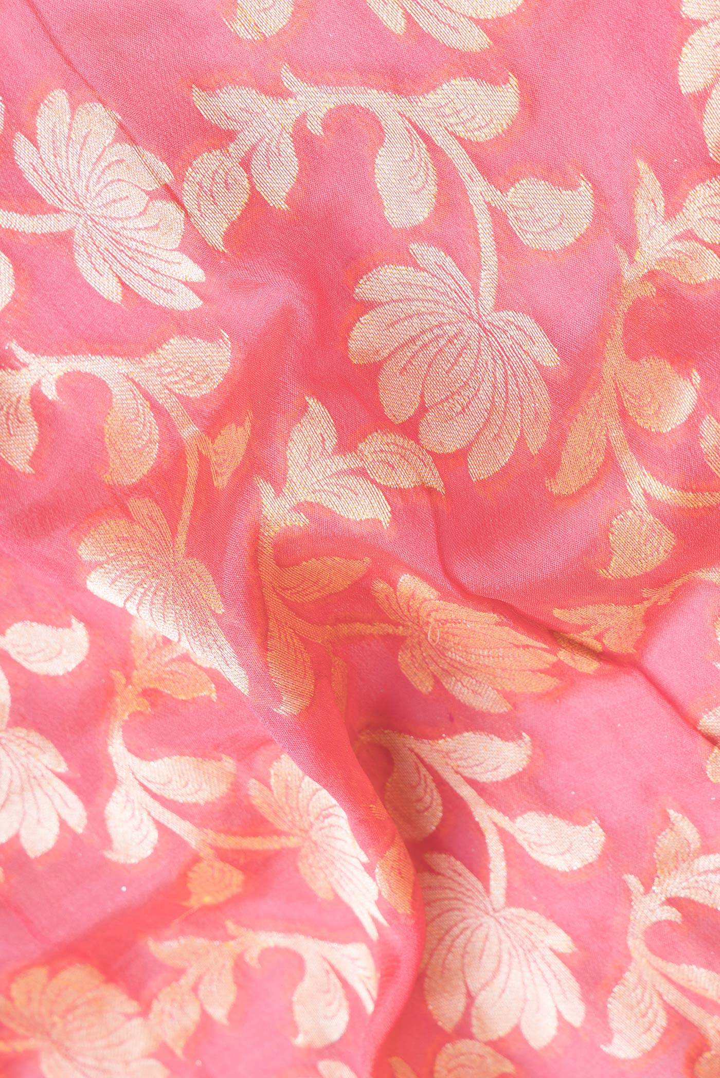 Close up of Pink Dual Tone Mysore Georgette Saree with Zari Brocade on the body and Thread Border.  displaying folds