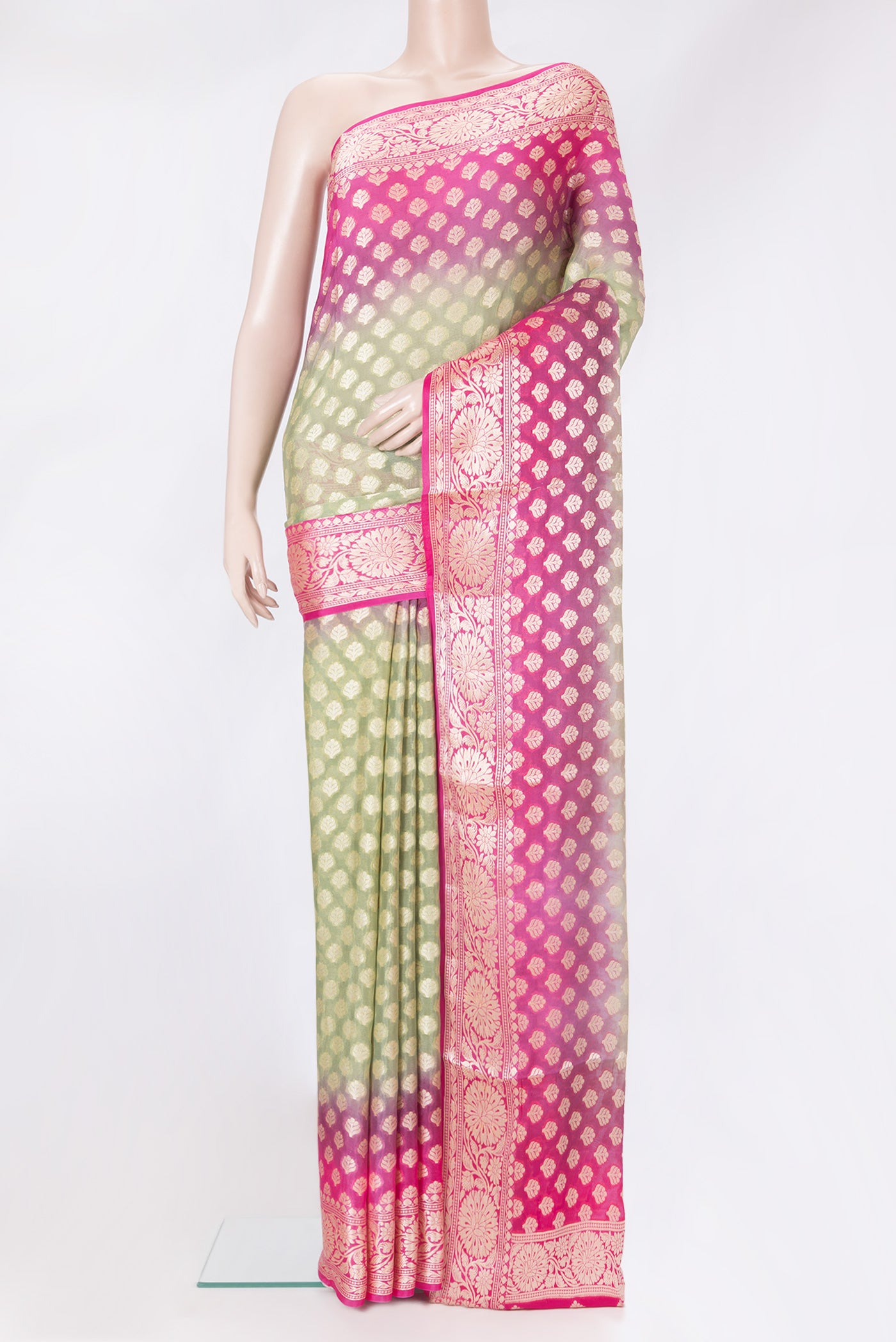 Light Green Banarasi Georgette Saree with Zari Brocade on the body and Zari Border.  displayed on a mannequin