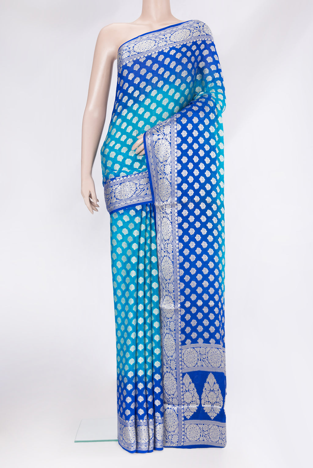 Sky Blue Banarasi Georgette Saree with Zari Brocade on the body and Zari Border.  displayed on a mannequin