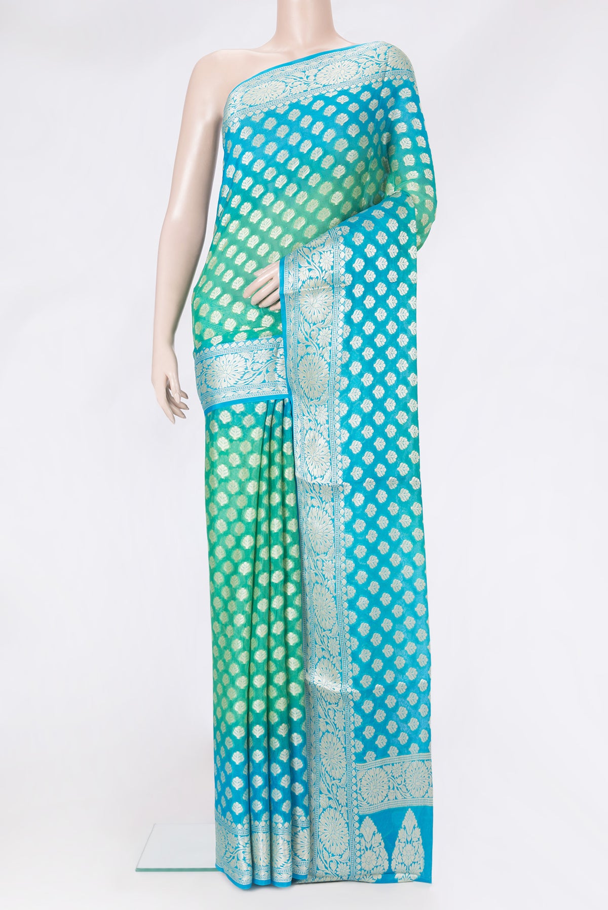 Sea Green Banarasi Georgette Saree with Zari Brocade on the body and Zari And Thread Border.  displayed on a mannequin