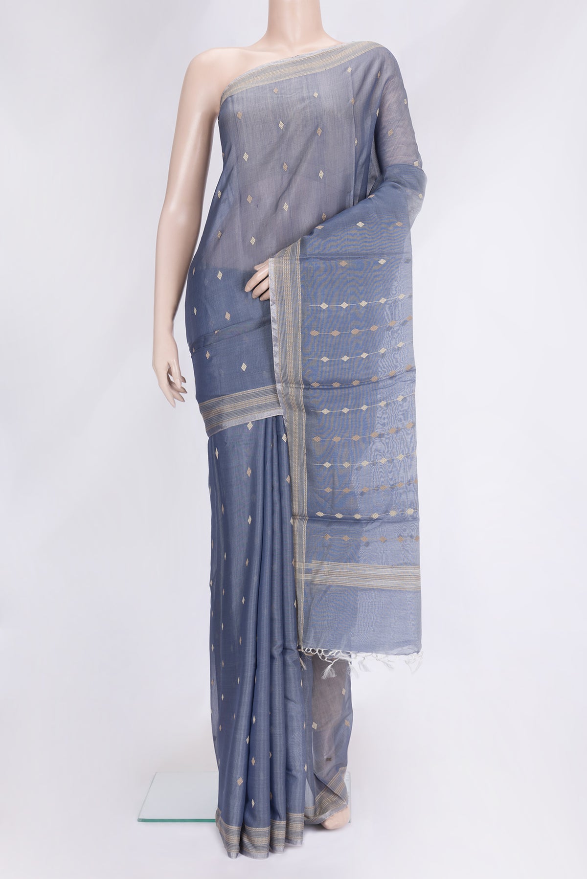 Grey Dual Tone Tussar Silk Saree with Thread Butta on the body and Zari And Thread Border.  displayed on a mannequin