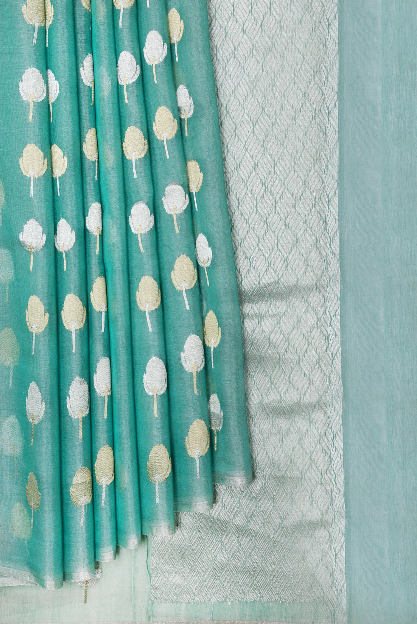 Pleats and pallu of Sea Green Dual Tone Organza Silk Saree with Zari Butta on the body and Zari Border. 