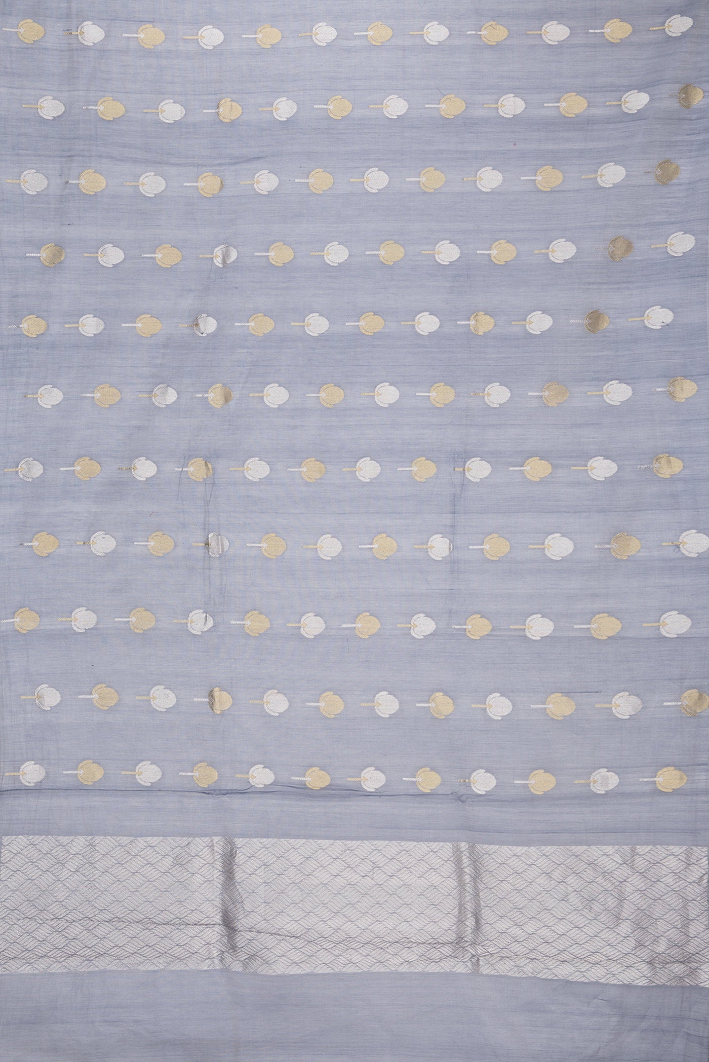 Flat view of Grey Dual Tone Organza Silk Saree with Zari Butta on the body and Zari Border. 