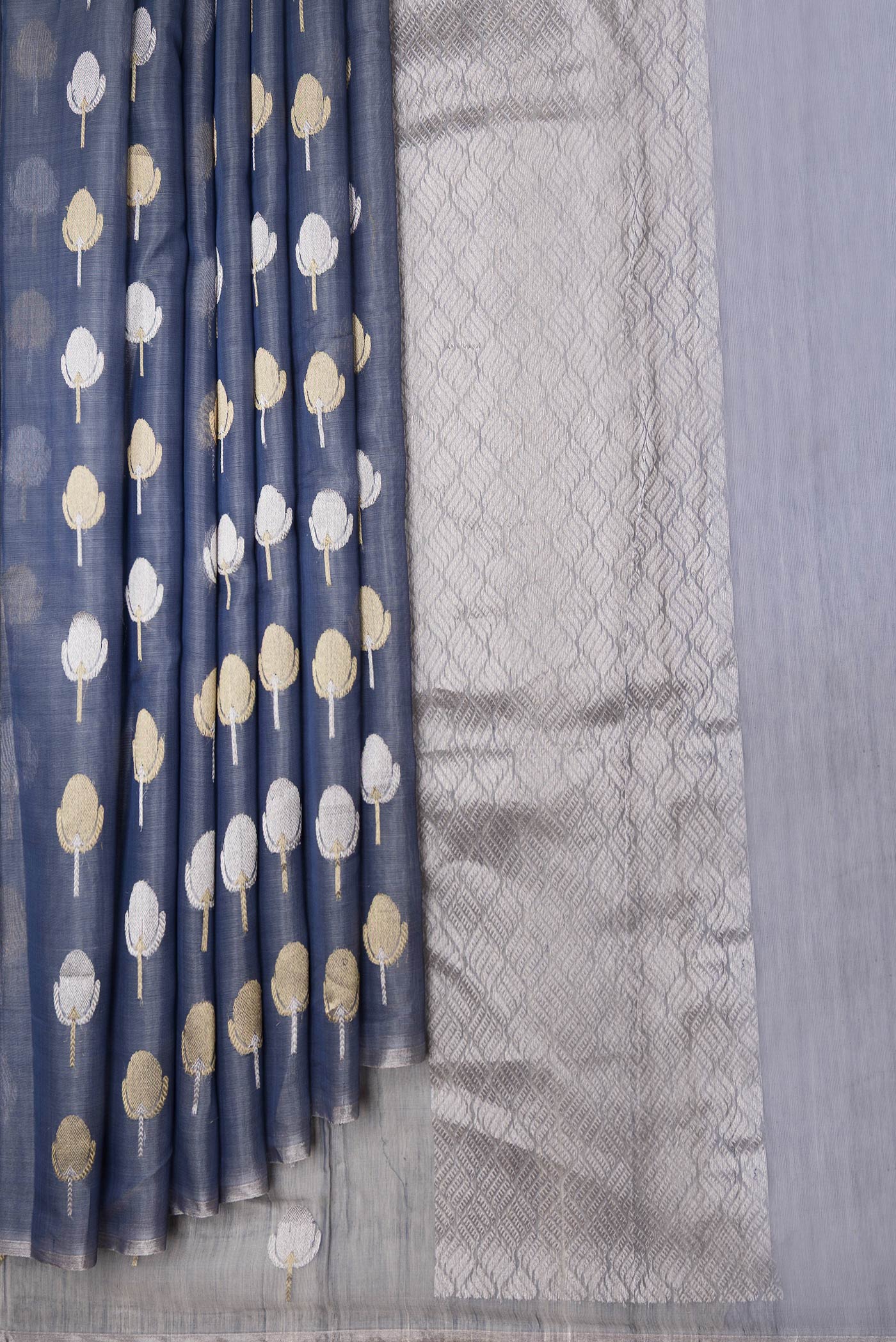 Pleats and pallu of Grey Dual Tone Organza Silk Saree with Zari Butta on the body and Zari Border. 