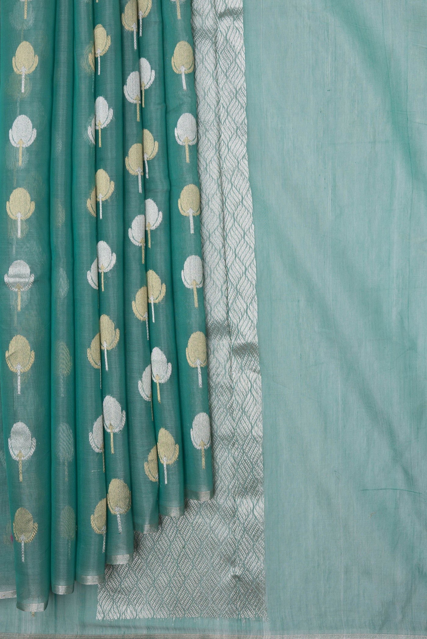 Pleats and pallu of Sea Green Dual Tone Organza Silk Saree with Zari Butta on the body and Zari Border. 