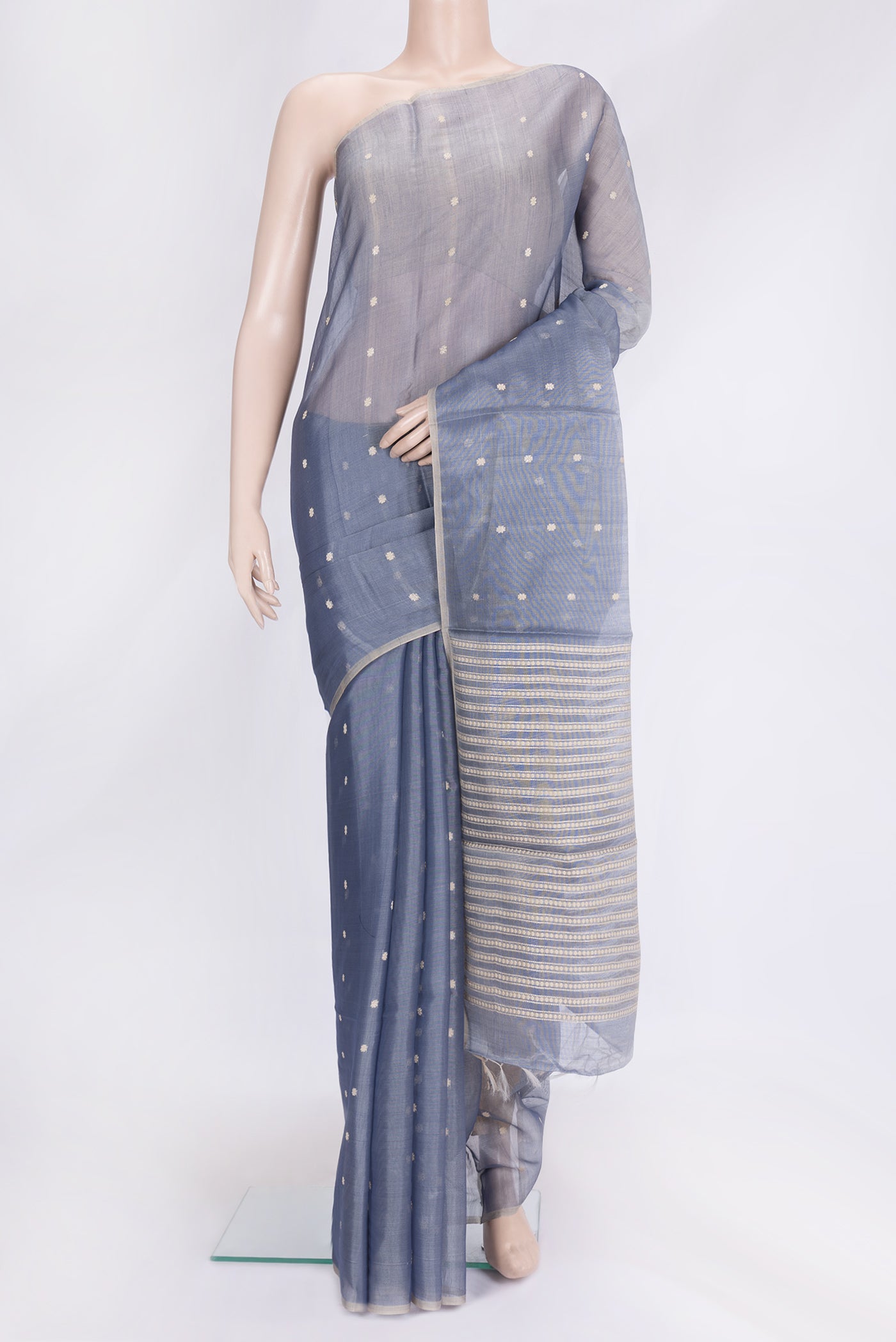 Grey Dual Tone Tussar Silk Saree with Thread Butta on the body and Without Border.  displayed on a mannequin