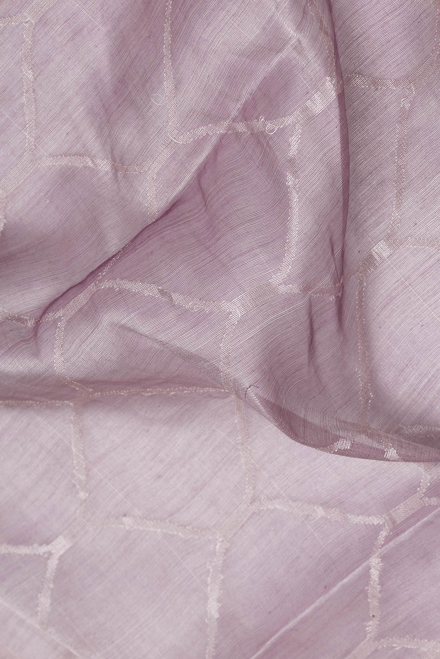 Close up of Lavender Dual Tone Organza Silk Saree with Zari Brocade on the body and Zari Border.  displaying folds