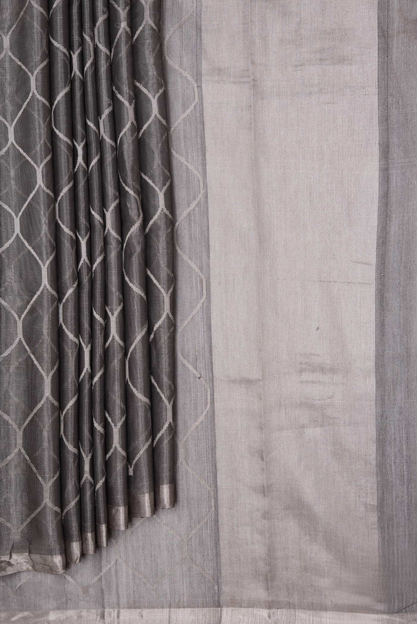 Pleats and pallu of Grey Dual Tone Organza Silk Saree with Zari Brocade on the body and Zari Border. 