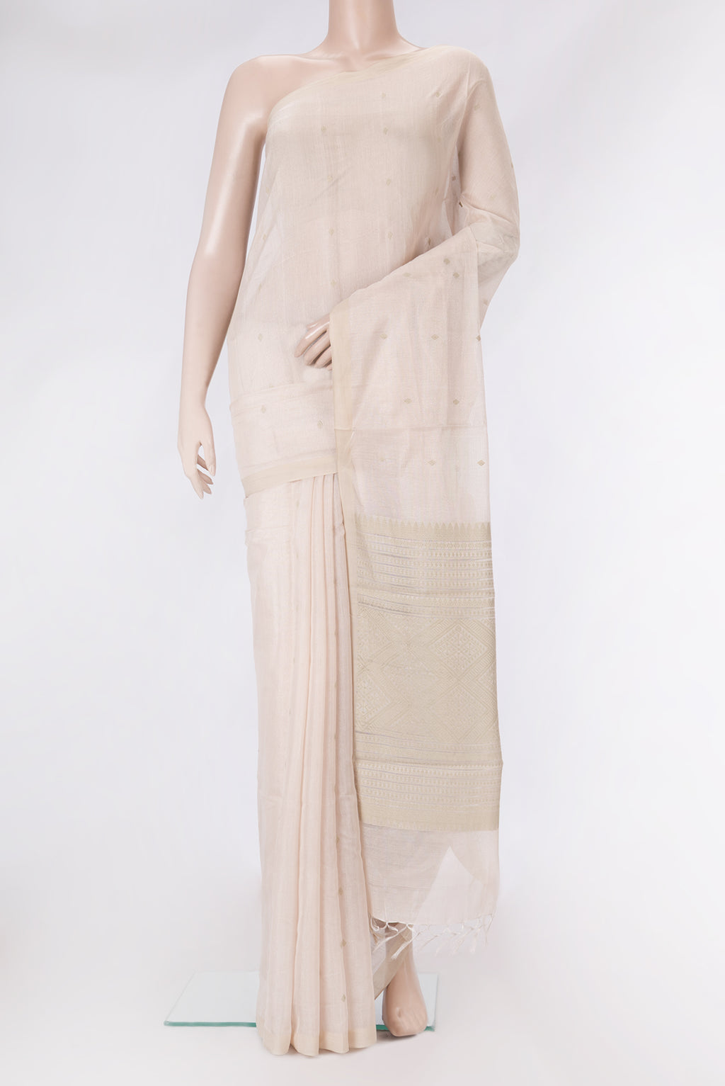 Rose Gold Dual Tone Tussar Silk Saree with Zari Butta on the body and Plain Border.  displayed on a mannequin