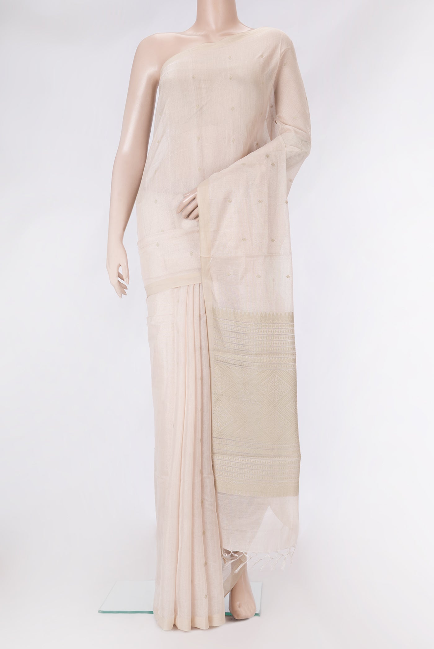 Rose Gold Dual Tone Tussar Silk Saree with Zari Butta on the body and Plain Border.  displayed on a mannequin