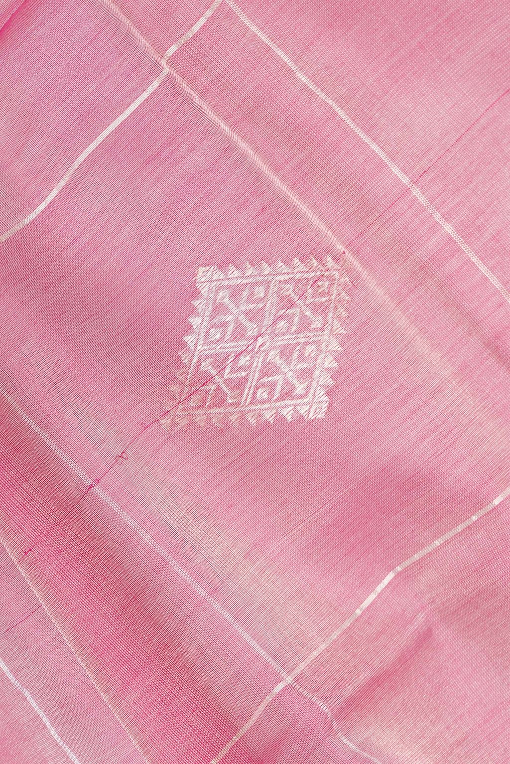 Close up of Pink Tussar Saree with Checked design on the body and Zari Border.  displaying folds