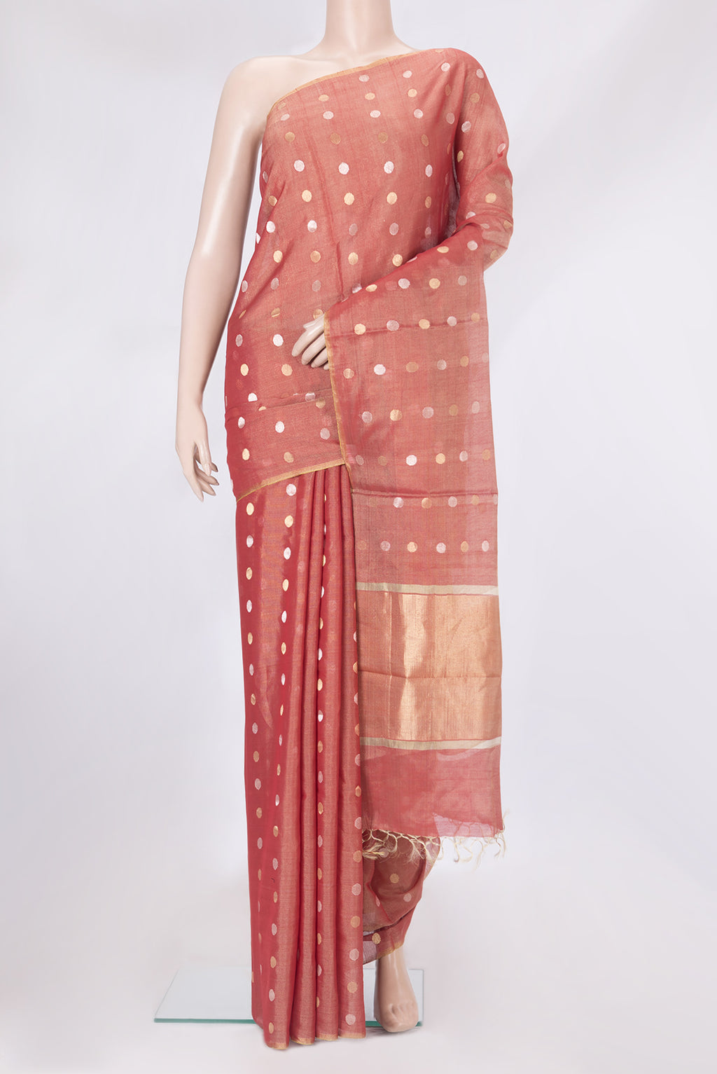 Coral Tussar Silk Saree with Zari Butta on the body and Zari Border.  displayed on a mannequin