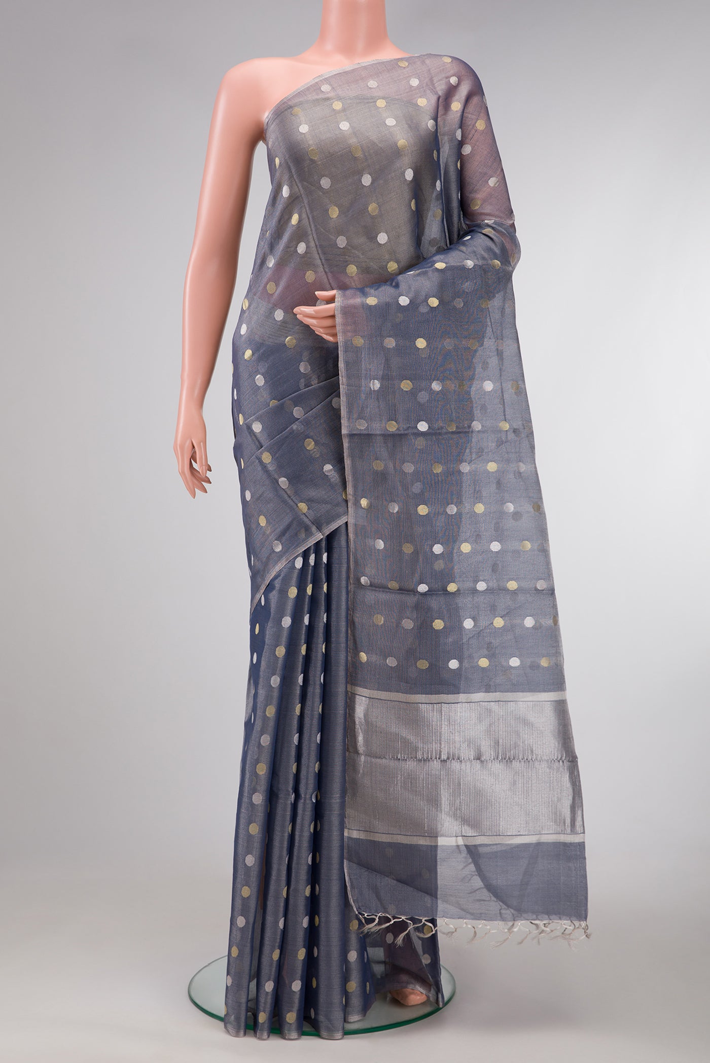 Grey Dual Tone Chanderi Tissue Silk Saree with Zari Butta on the body and Zari Border.  displayed on a mannequin