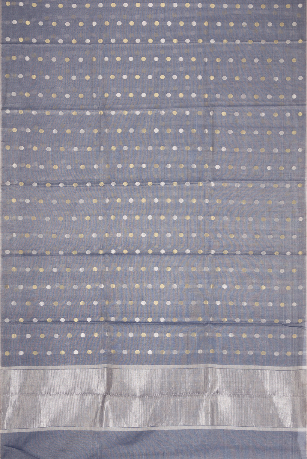 Flat view of Grey Dual Tone Chanderi Tissue Silk Saree with Zari Butta on the body and Zari Border. 