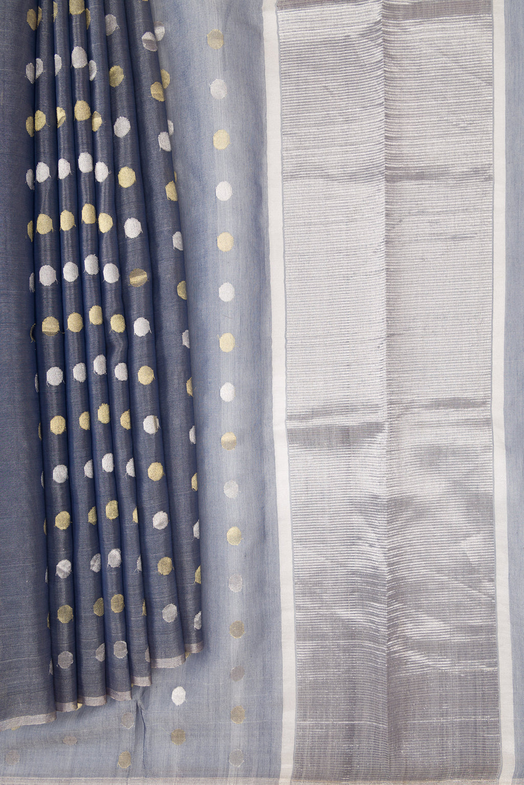 Pleats and pallu of Grey Dual Tone Chanderi Tissue Silk Saree with Zari Butta on the body and Zari Border. 