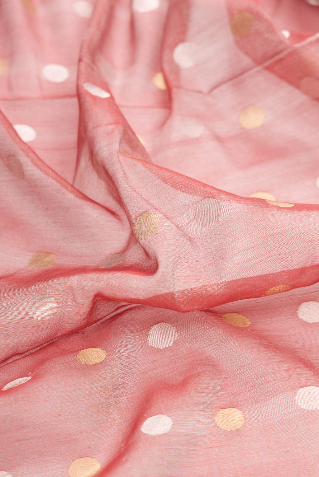 Close up of Red Dual Tone Chanderi Tissue Silk Saree with Zari Butta on the body and Zari Border.  displaying folds