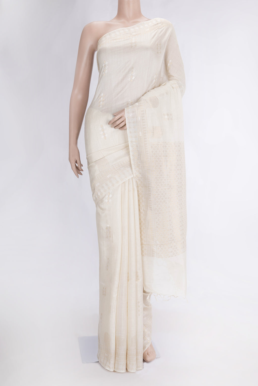 Beige Dual Tone Tussar Silk Saree with Zari Butta on the body and Fancy Border.  displayed on a mannequin