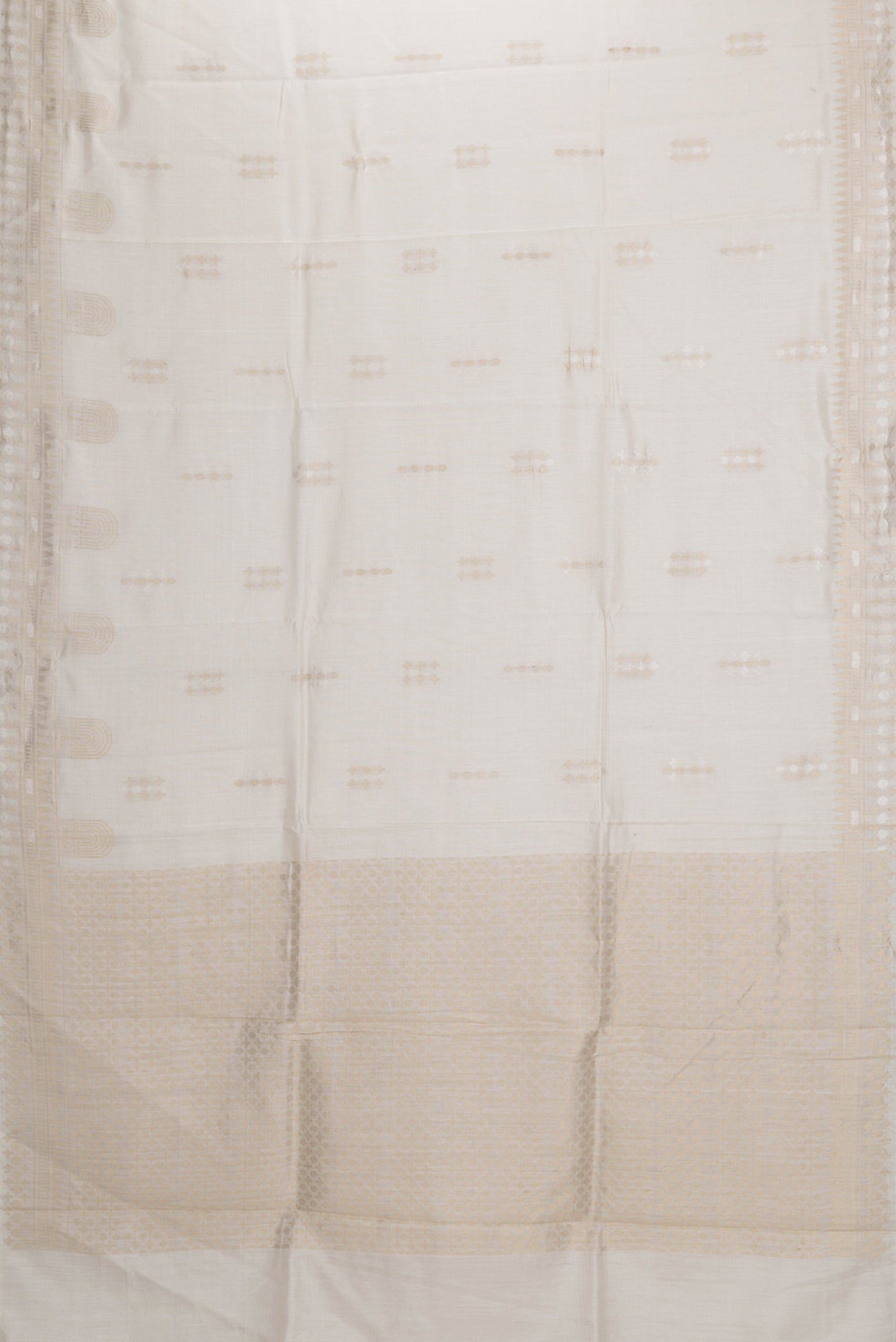 Flat view of Beige Dual Tone Tussar Silk Saree with Zari Butta on the body and Fancy Border. 
