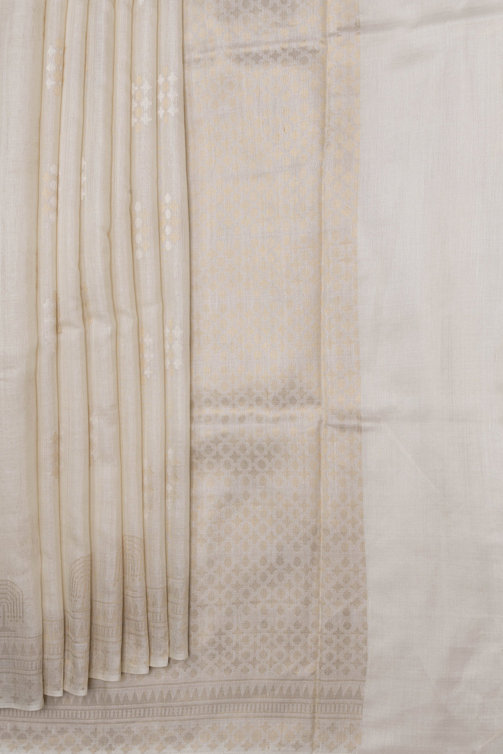 Pleats and pallu of Beige Dual Tone Tussar Silk Saree with Zari Butta on the body and Fancy Border. 