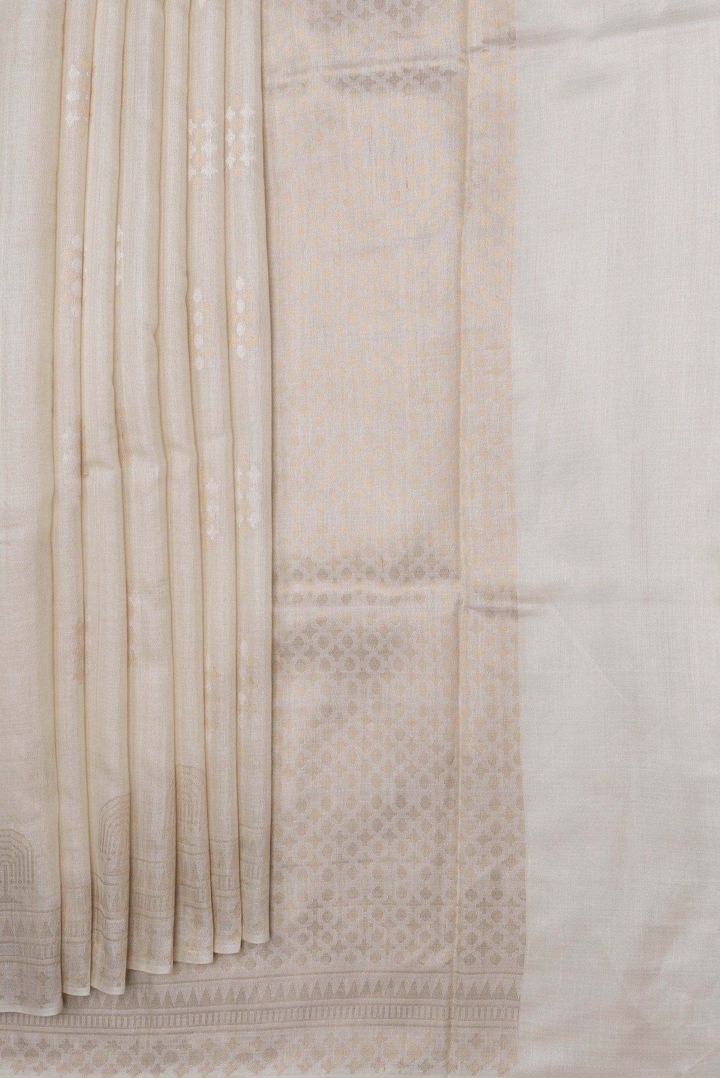 Pleats and pallu of Beige Dual Tone Tussar Silk Saree with Zari Butta on the body and Fancy Border. 