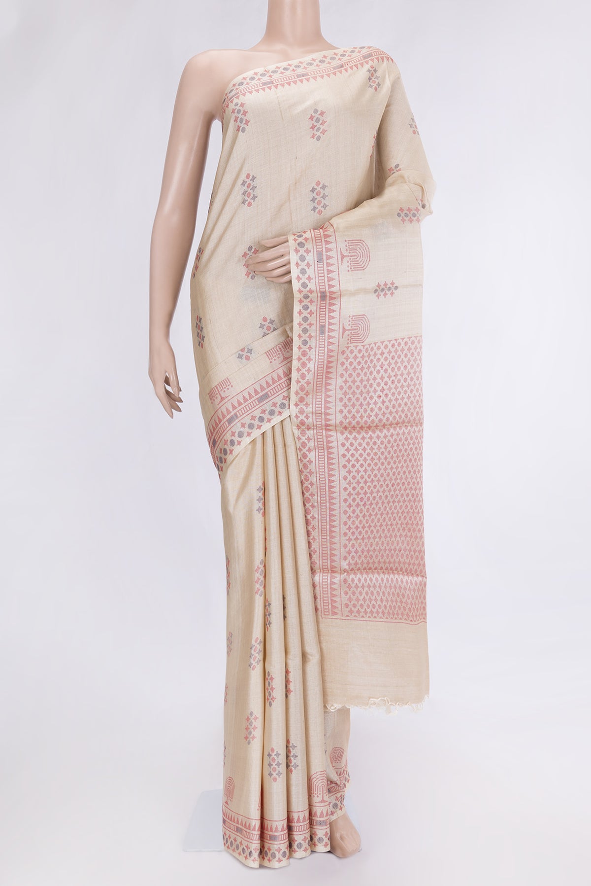 Beige Dual Tone Tussar Silk Saree with Thread Butta on the body and Thread Border.  displayed on a mannequin