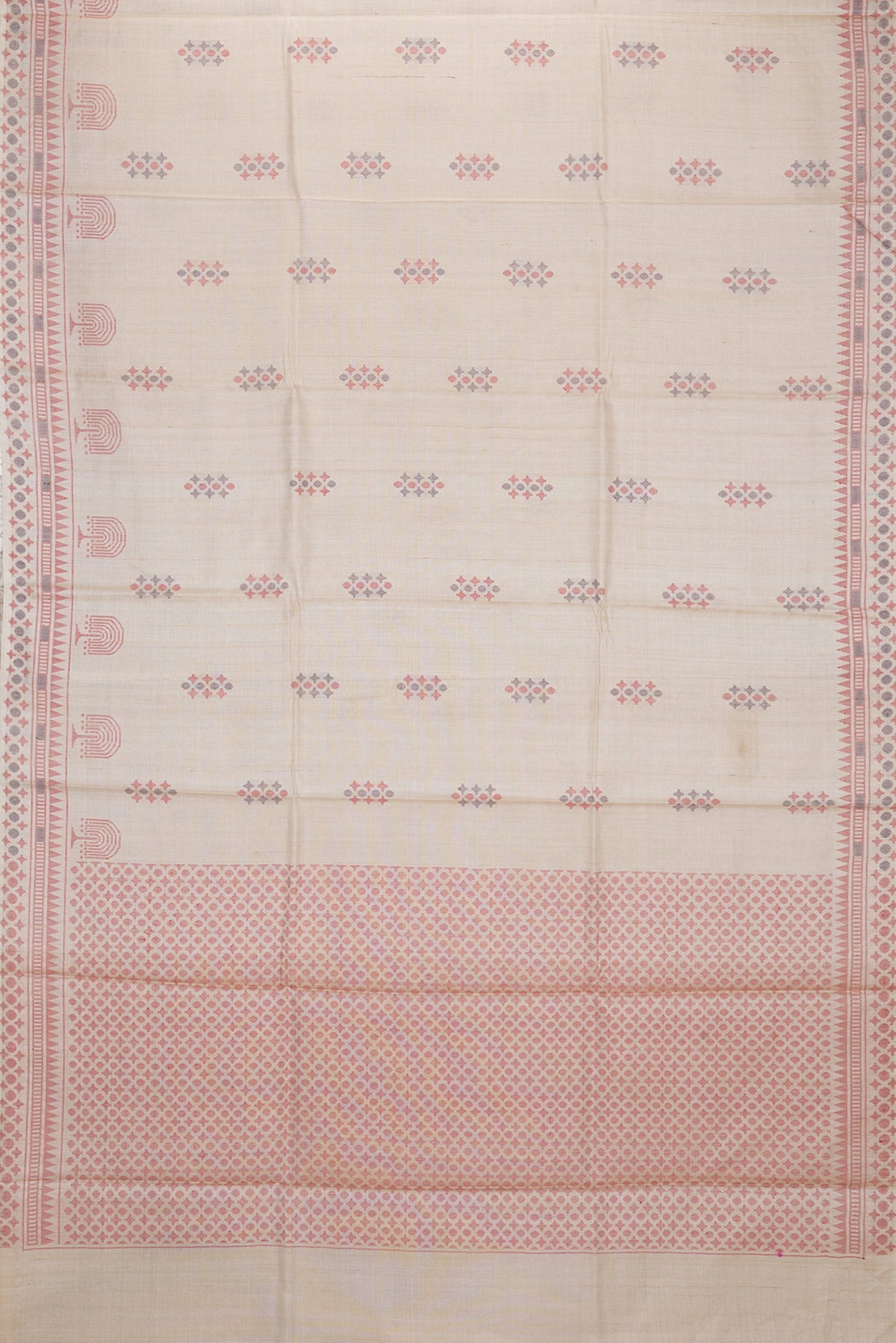 Flat view of Beige Dual Tone Tussar Silk Saree with Thread Butta on the body and Thread Border. 
