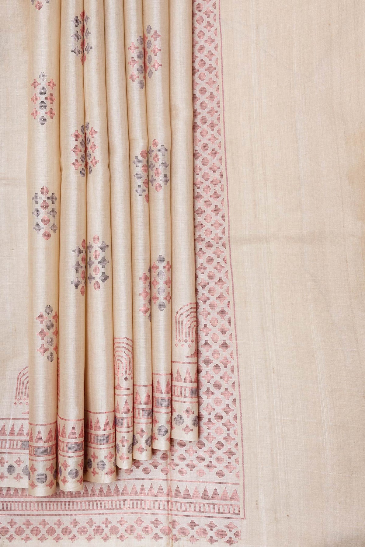 Pleats and pallu of Beige Dual Tone Tussar Silk Saree with Thread Butta on the body and Thread Border. 