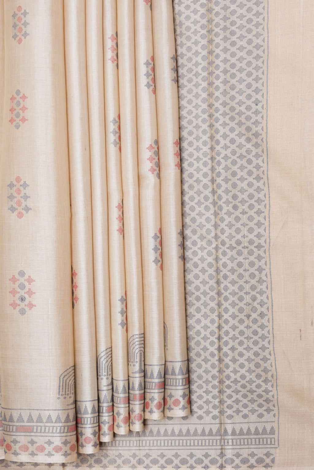 Pleats and pallu of Beige Dual Tone Tussar Silk Saree with Thread Butta on the body and Thread Border. 