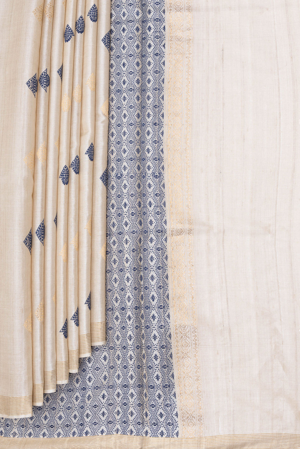 Pleats and pallu of Beige Dual Tone Tussar Silk Saree with Zari And Thread Butta on the body and Zari Border. 