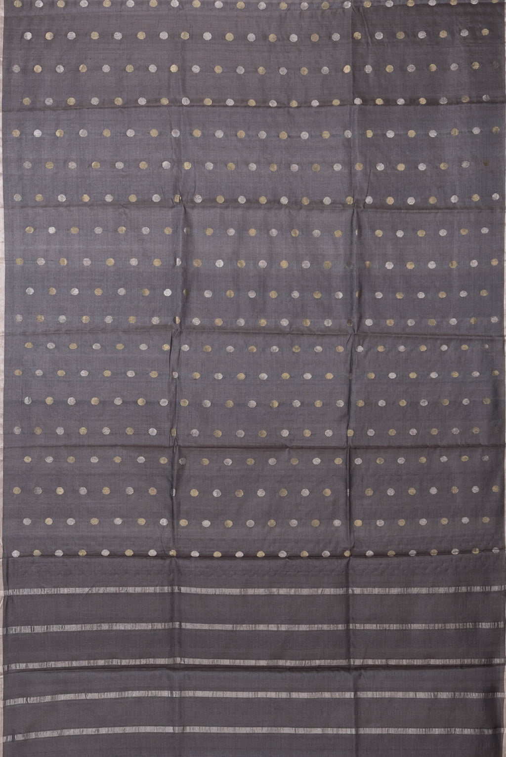Flat view of Grey Dual Tone Tussar Silk Saree with Zari Butta on the body and Zari Border. 