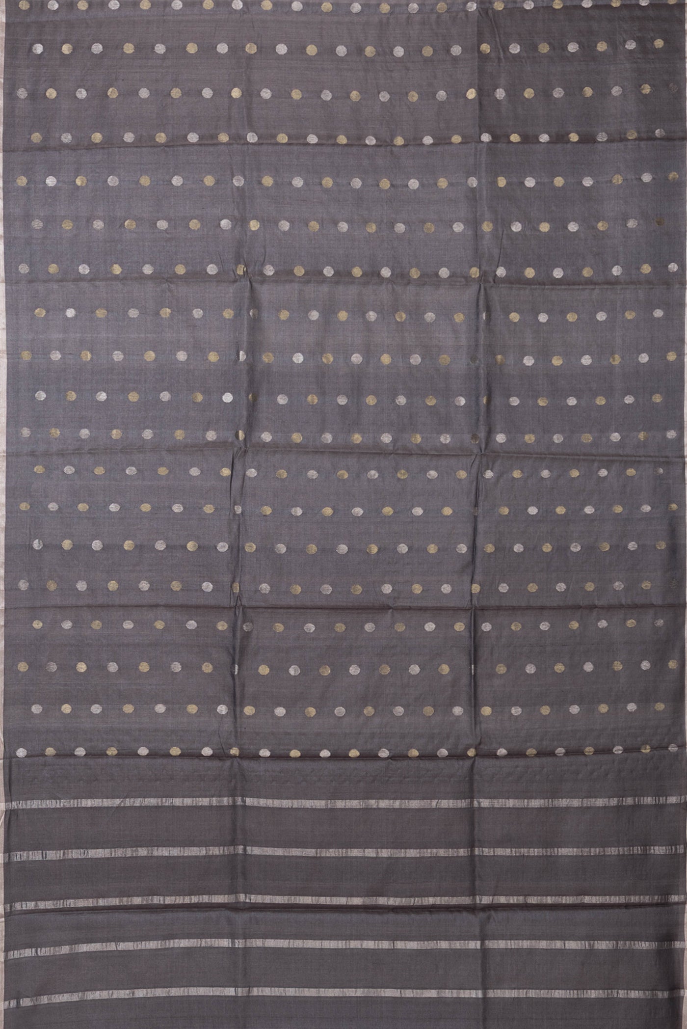 Flat view of Grey Dual Tone Tussar Silk Saree with Zari Butta on the body and Zari Border. 
