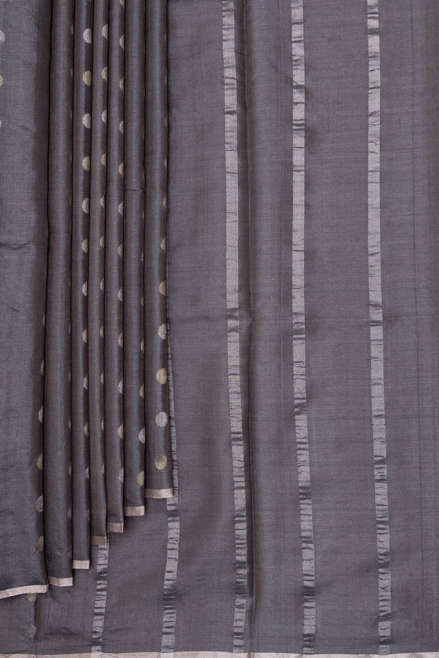 Pleats and pallu of Grey Dual Tone Tussar Silk Saree with Zari Butta on the body and Zari Border. 