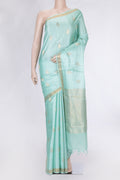 Sea Green Dual Tone Tussar Silk Saree with Zari Butta on the body and Zari Border.  displayed on a mannequin