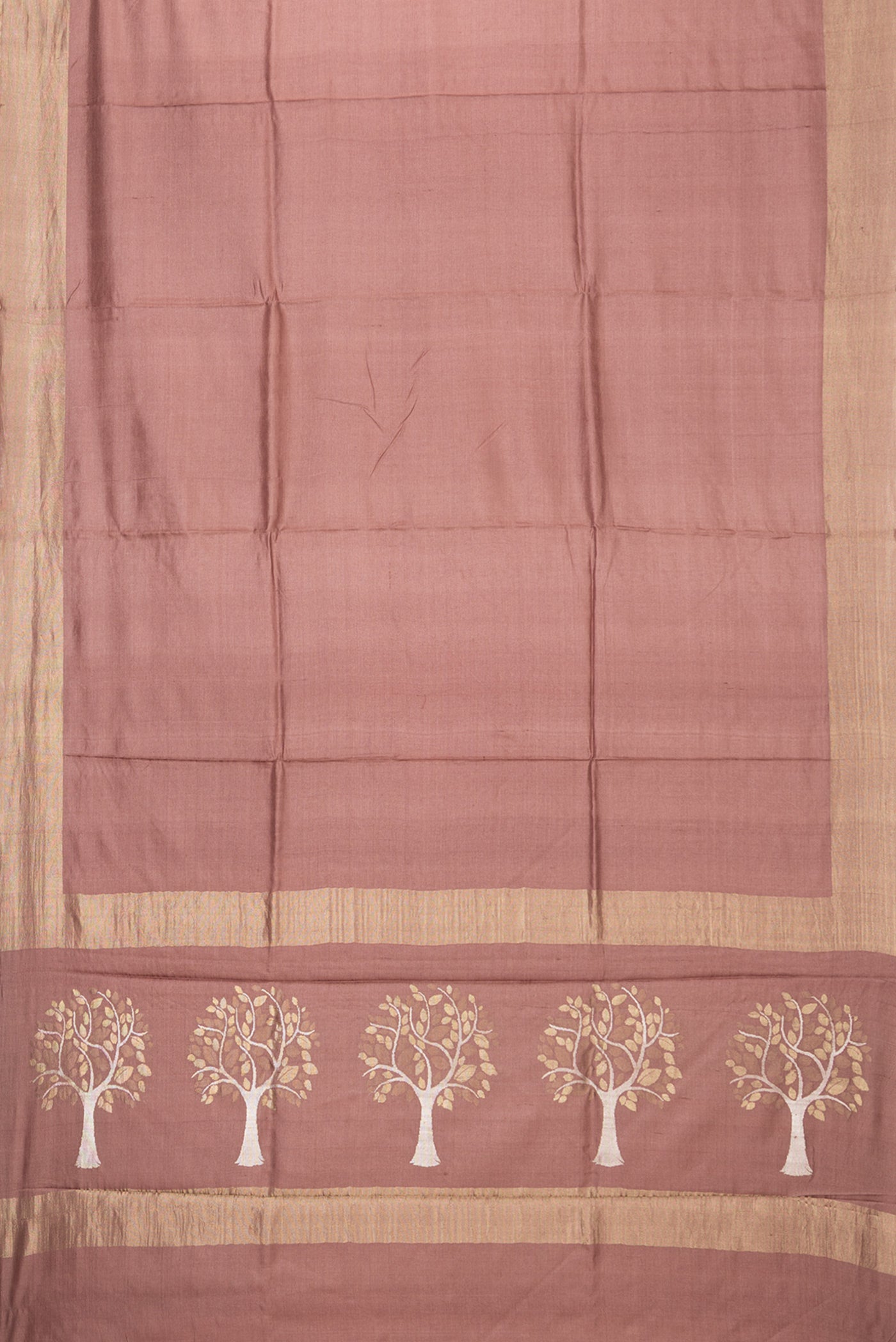 Flat view of Brown Tussar Silk Saree with Plain Body and Zari Border. 